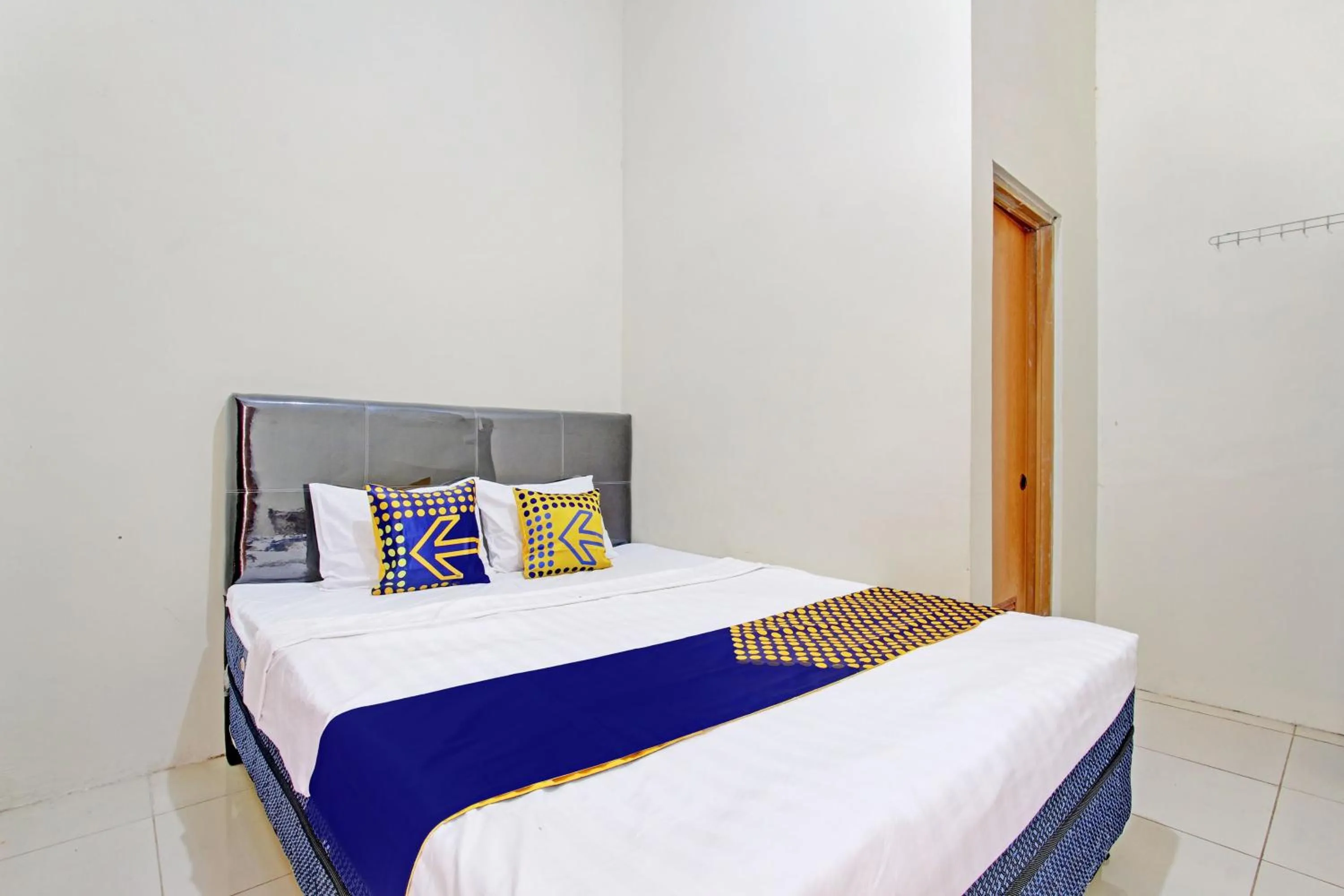 Bedroom in Hotel O Guest House Cemara 1 Syariah