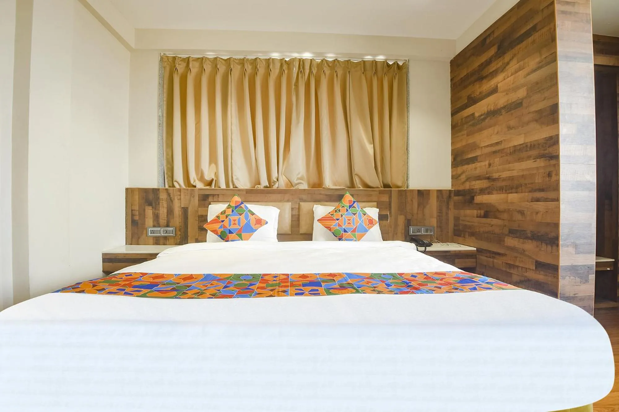 Bed in FabHotel Avasa Grand - Nr Big Daddy Casino