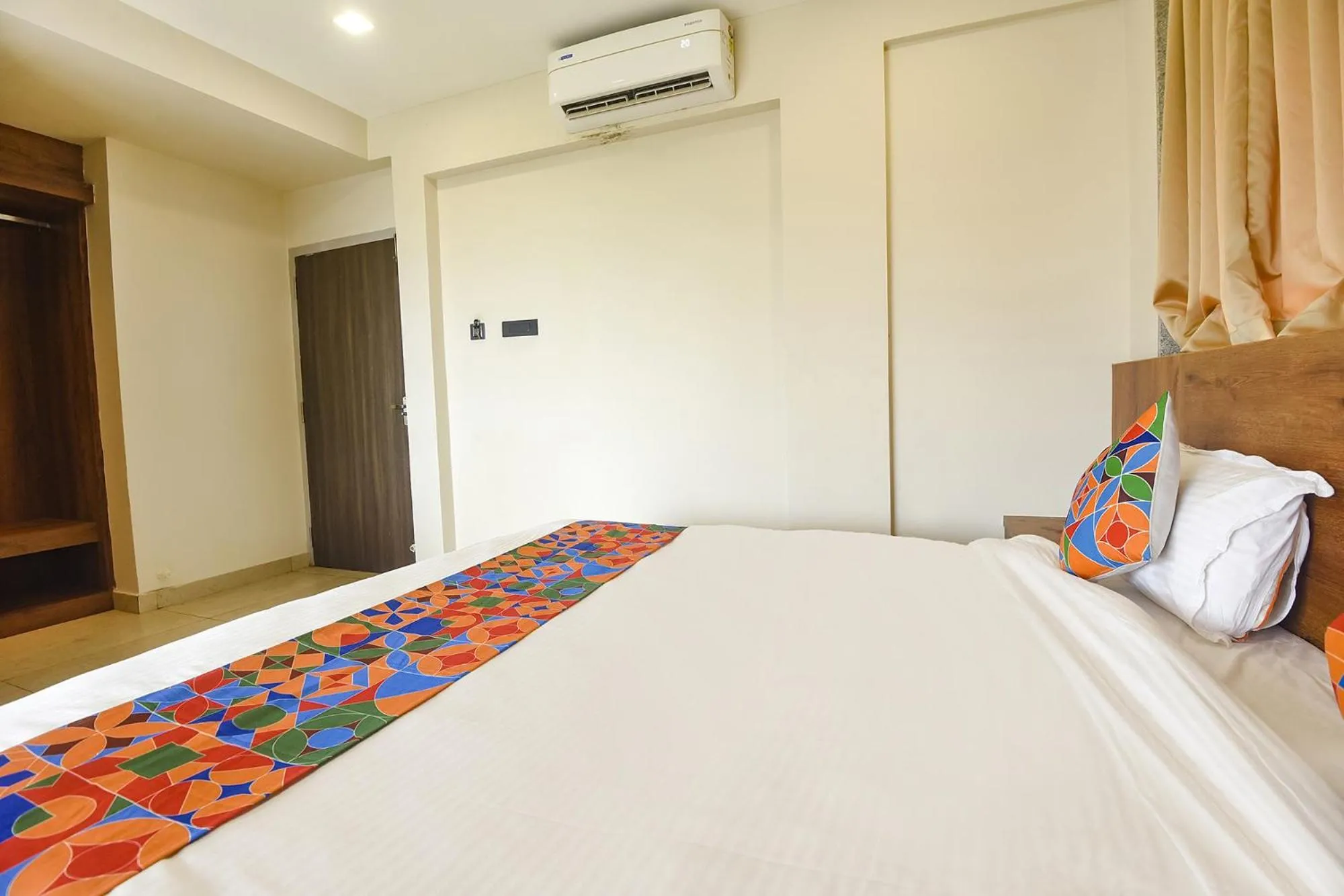 Bed in FabHotel Avasa Grand - Nr Big Daddy Casino