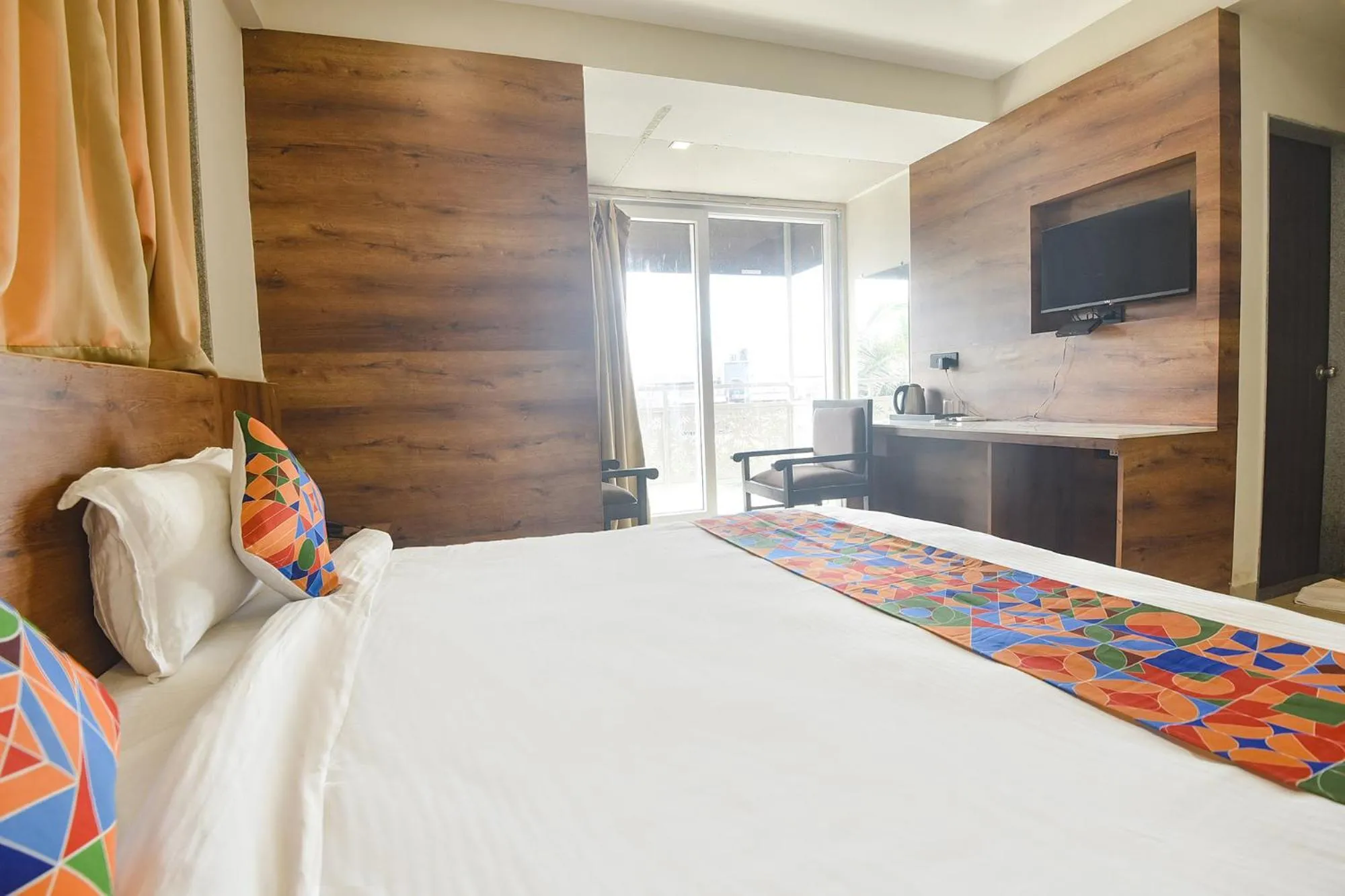 Bed in FabHotel Avasa Grand - Nr Big Daddy Casino