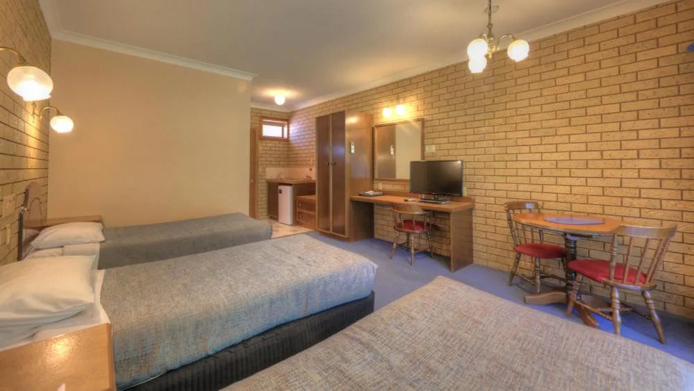 Bed in Barrass's John Bright Motor Inn