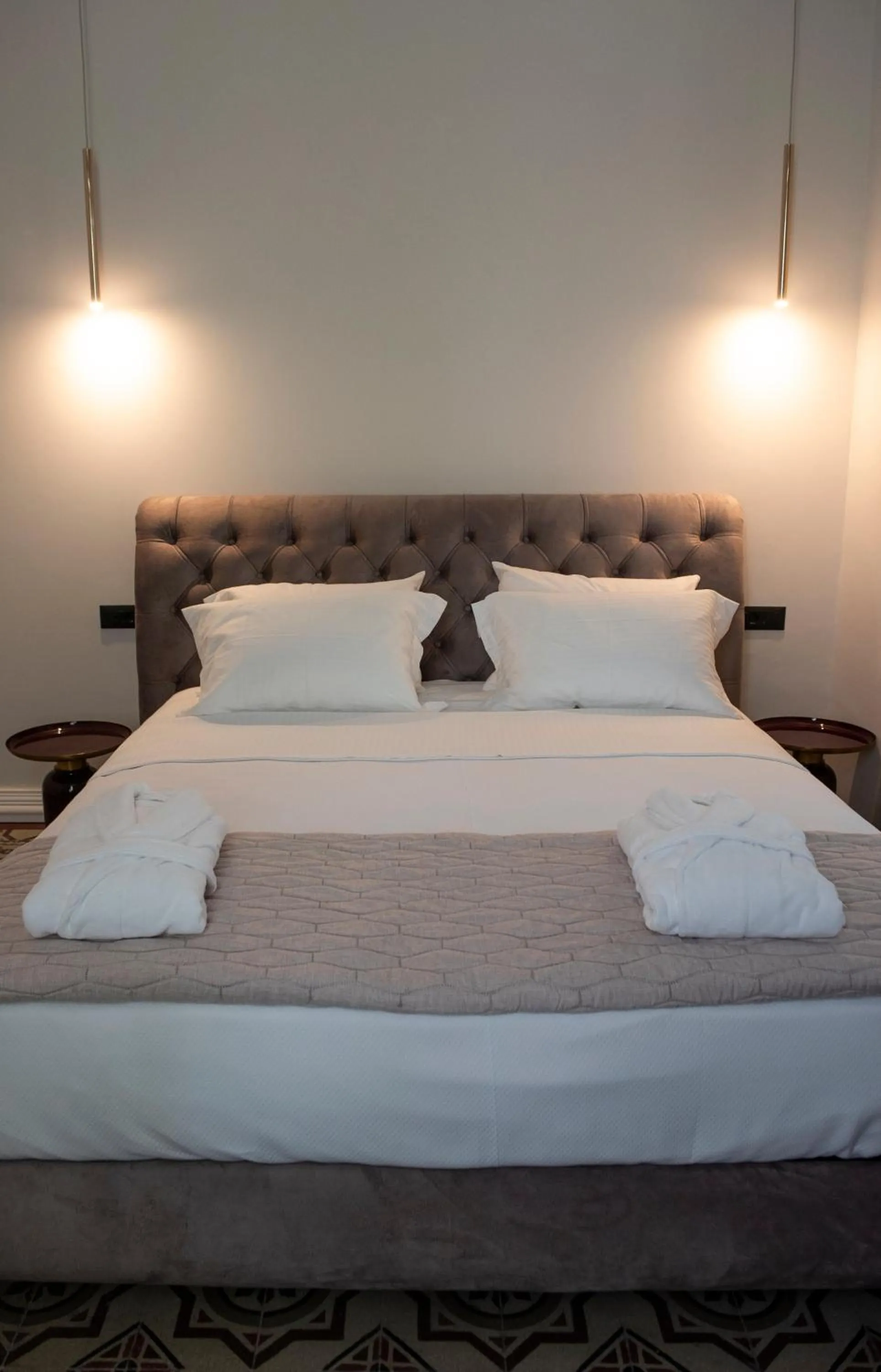 Bed in Jensen Luxury Suites