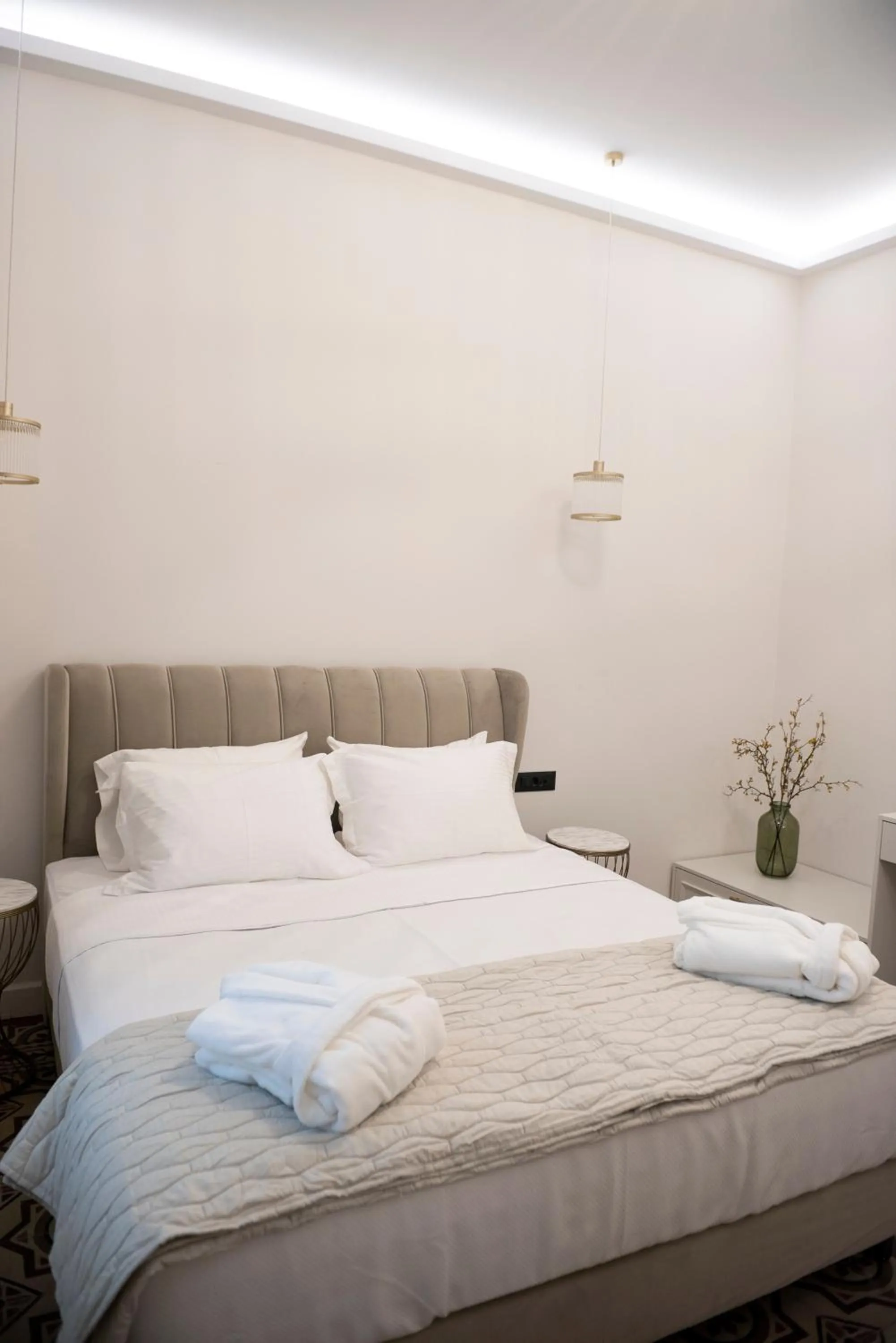 Bed in Jensen Luxury Suites