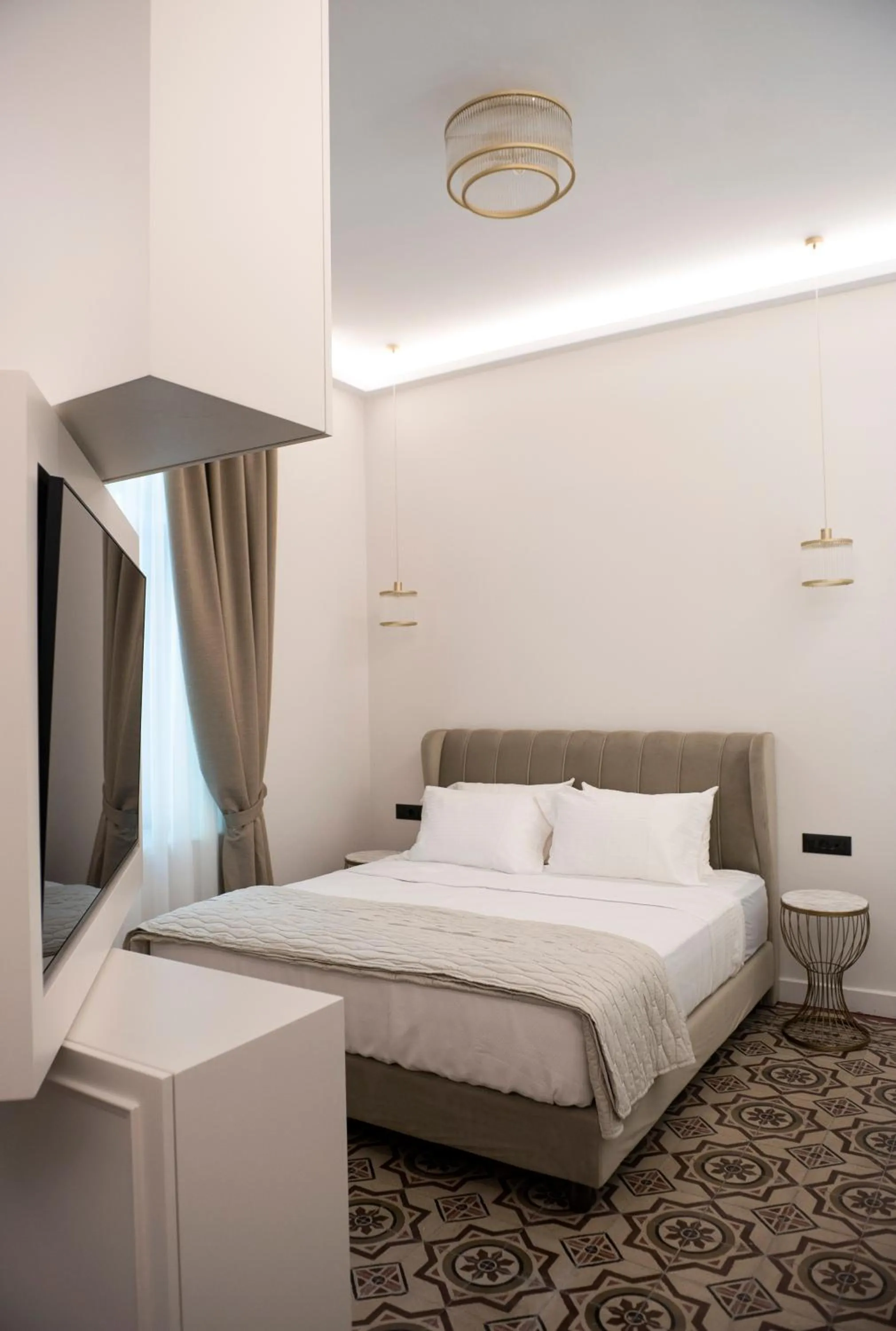 Bed in Jensen Luxury Suites