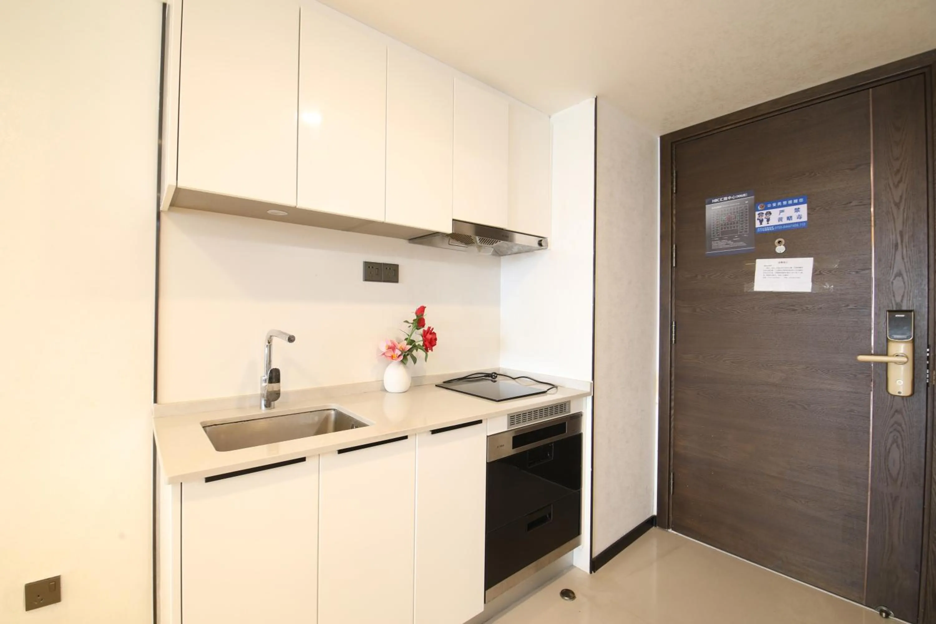 Kitchen or kitchenette in Xinghe Times Apartment - Shenzhen North Railway Station