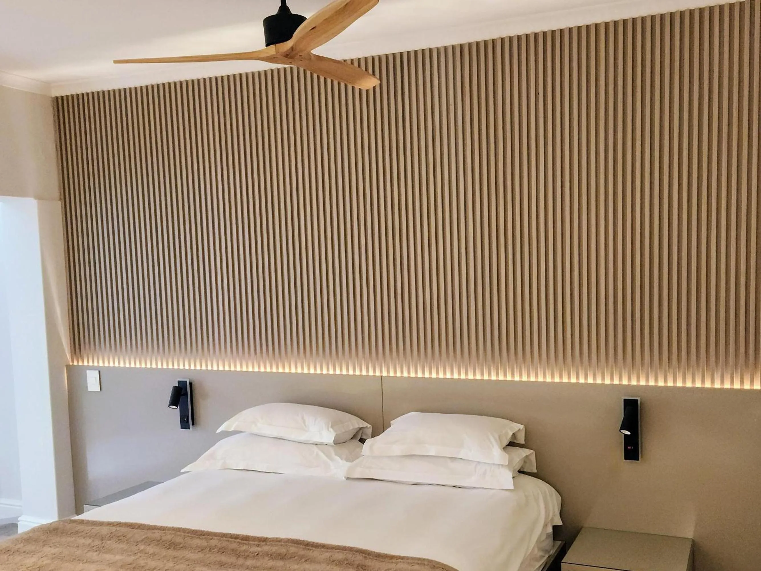 Bed in Blue Views Studio Apartments