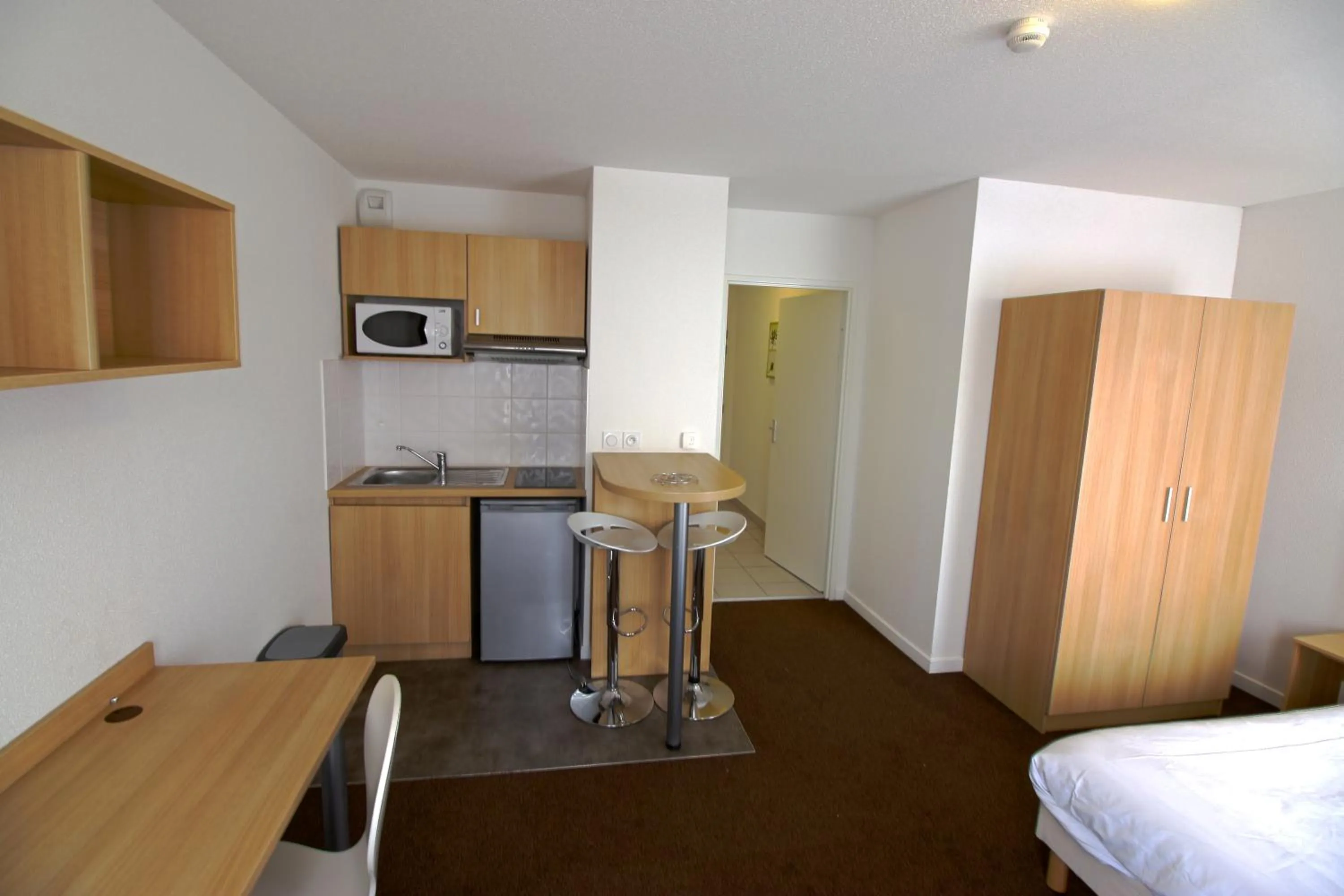 Bed in Kosy Appart Hôtel Résidence Arboréa