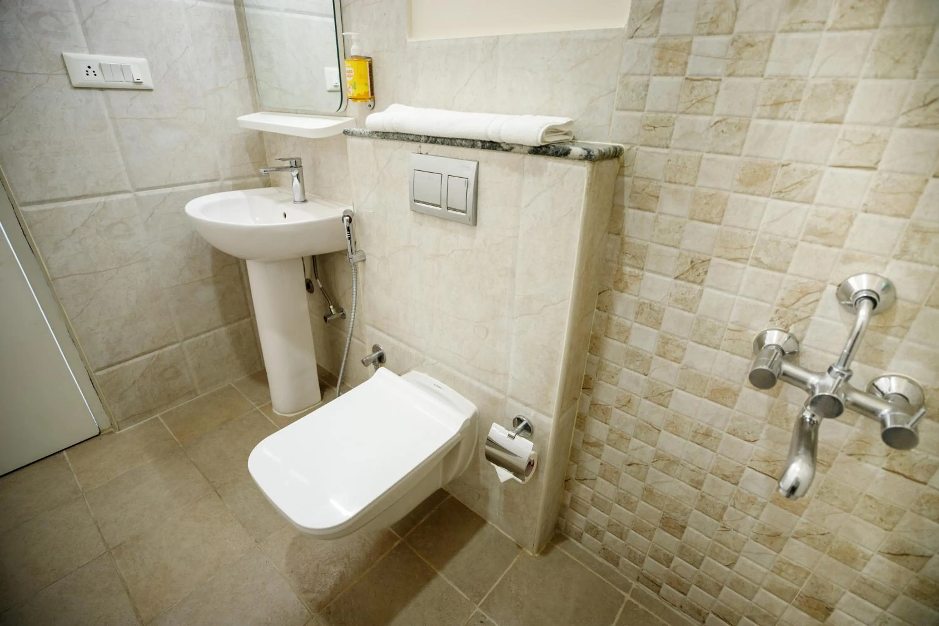 Toilet in Bloom Hotel - HAL Old Airport Rd