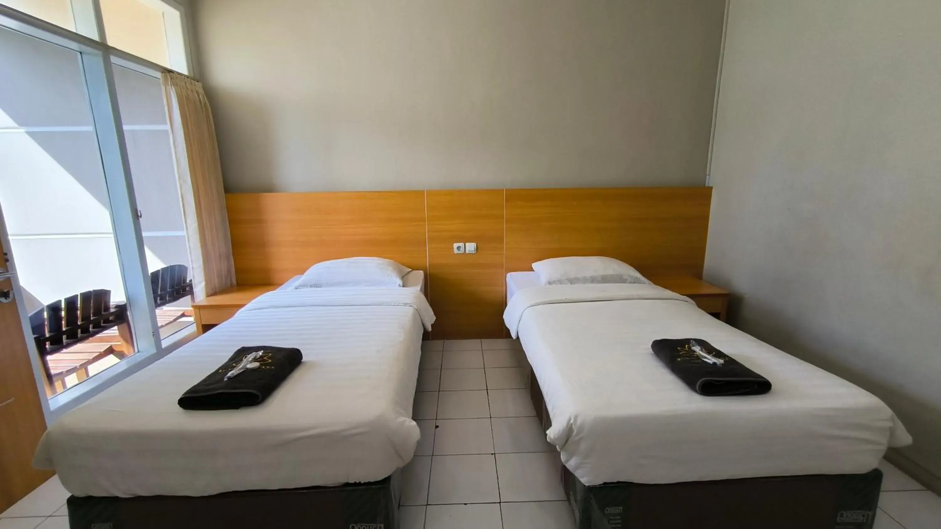 Deluxe Twin Room in Royal Kencana Hotel powered by Cocotel Deluxe Twin Room in Royal Kencana Hotel powered by Cocotel