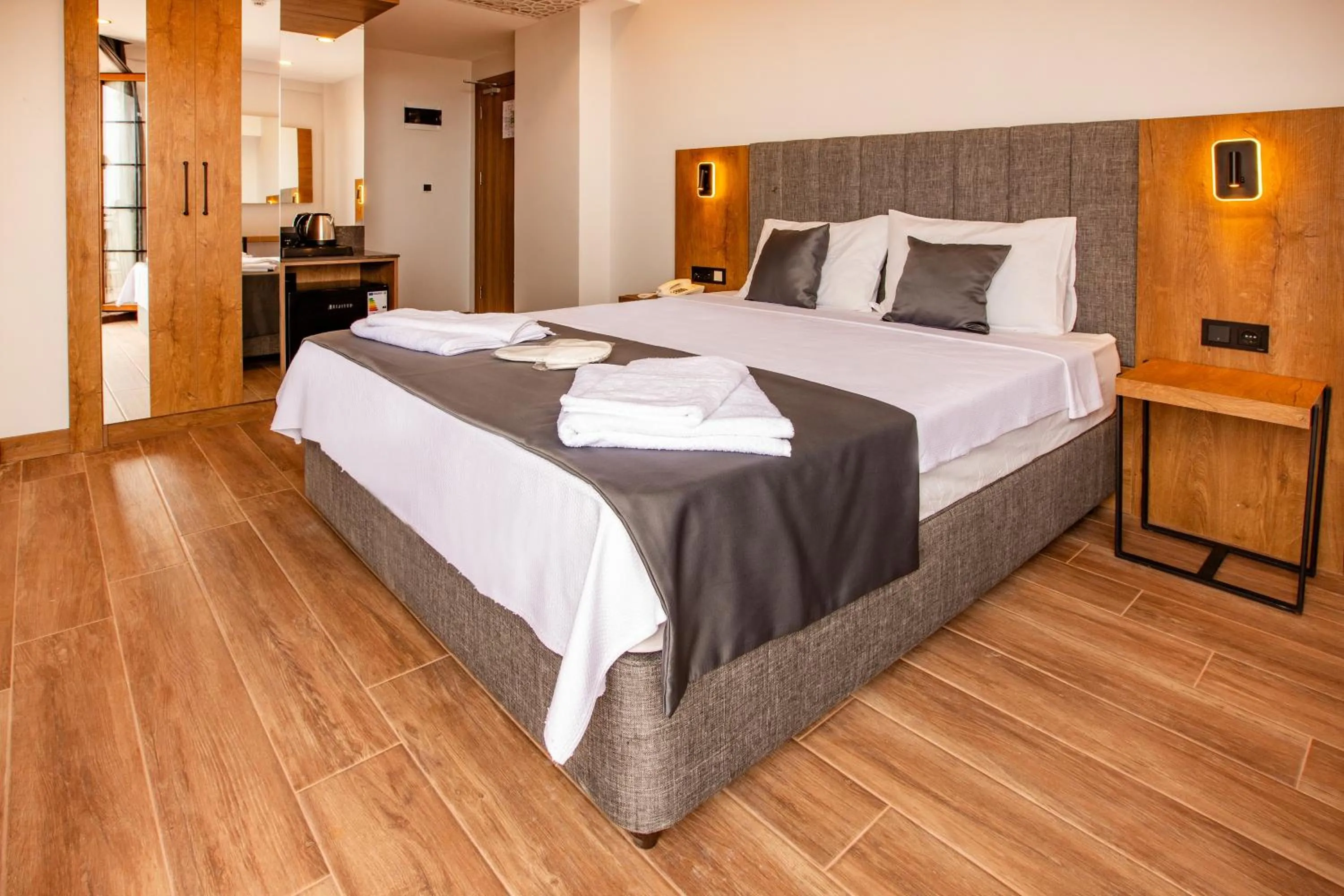 Bed in Grand Business Hotel