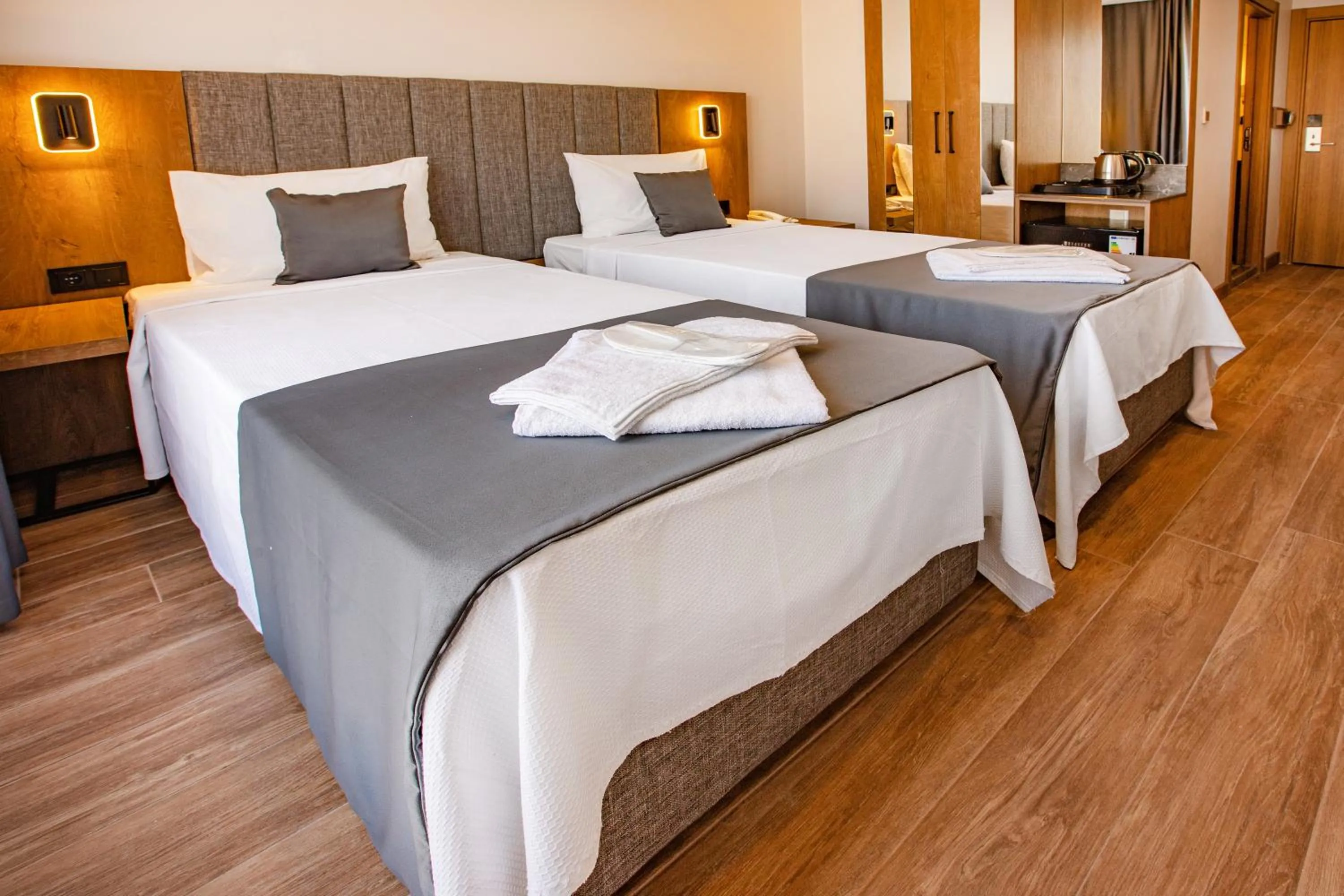 Bed in Grand Business Hotel