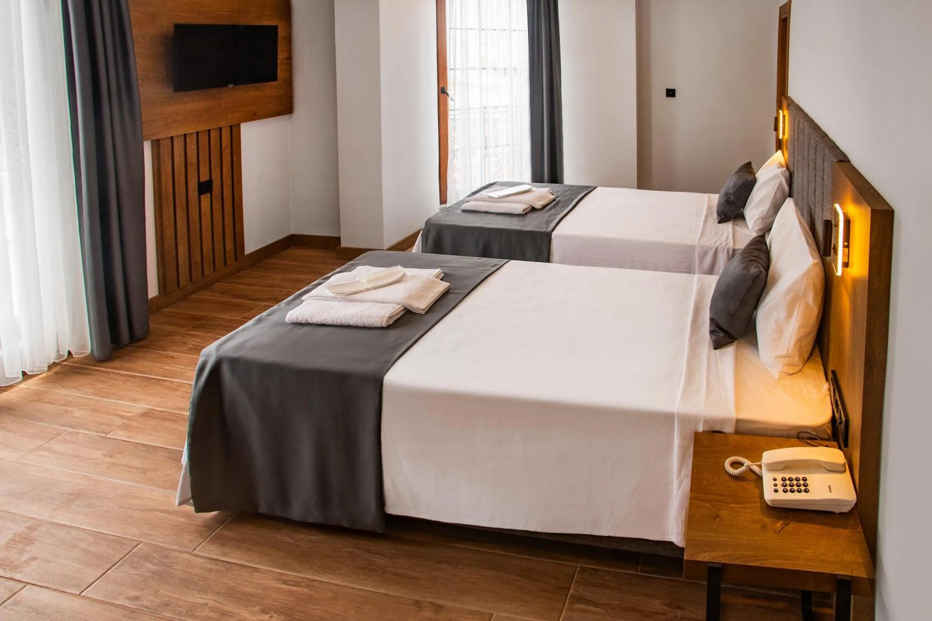 Bed in Grand Business Hotel