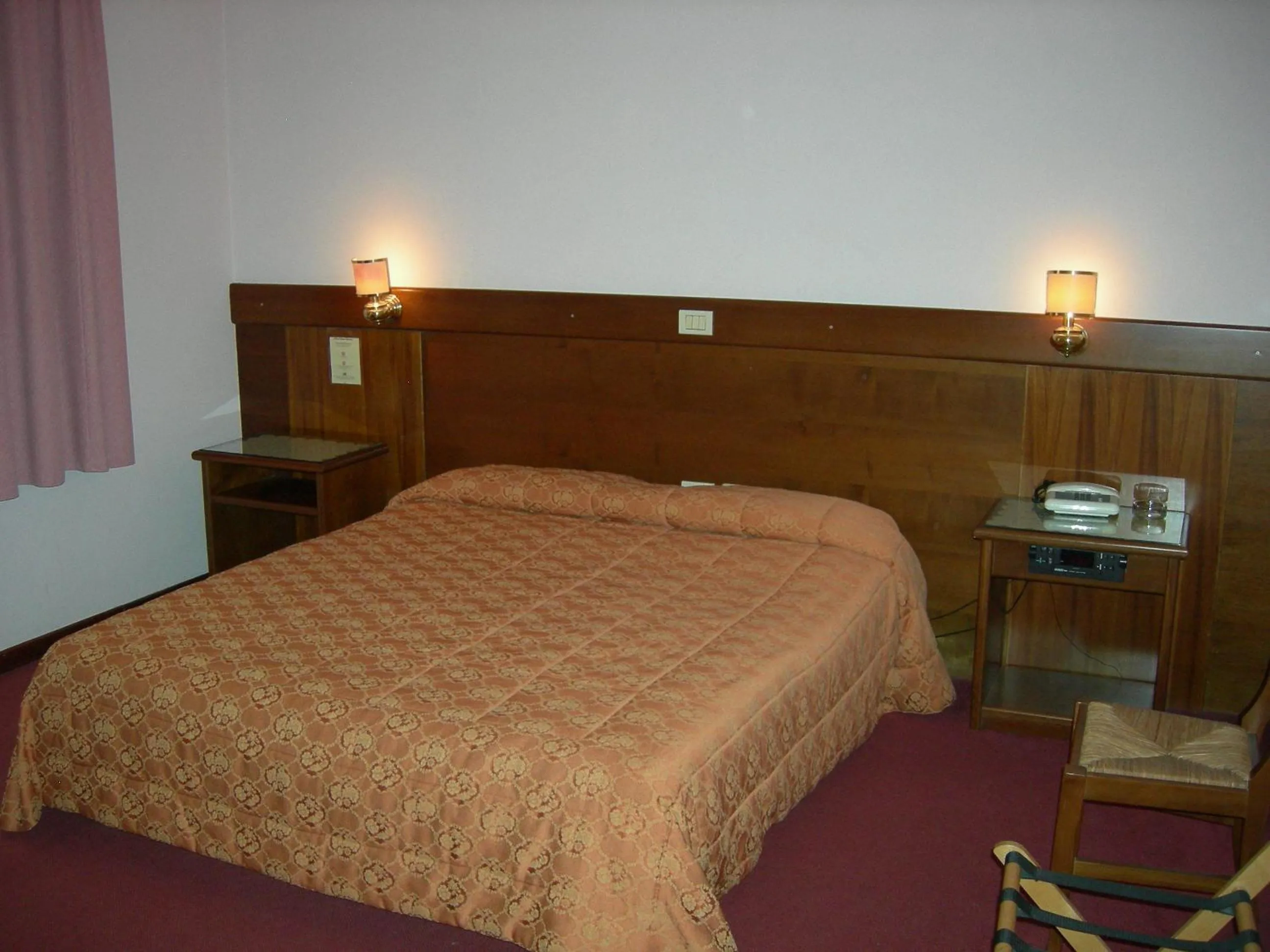 Bed in Albergo Santa Barbara