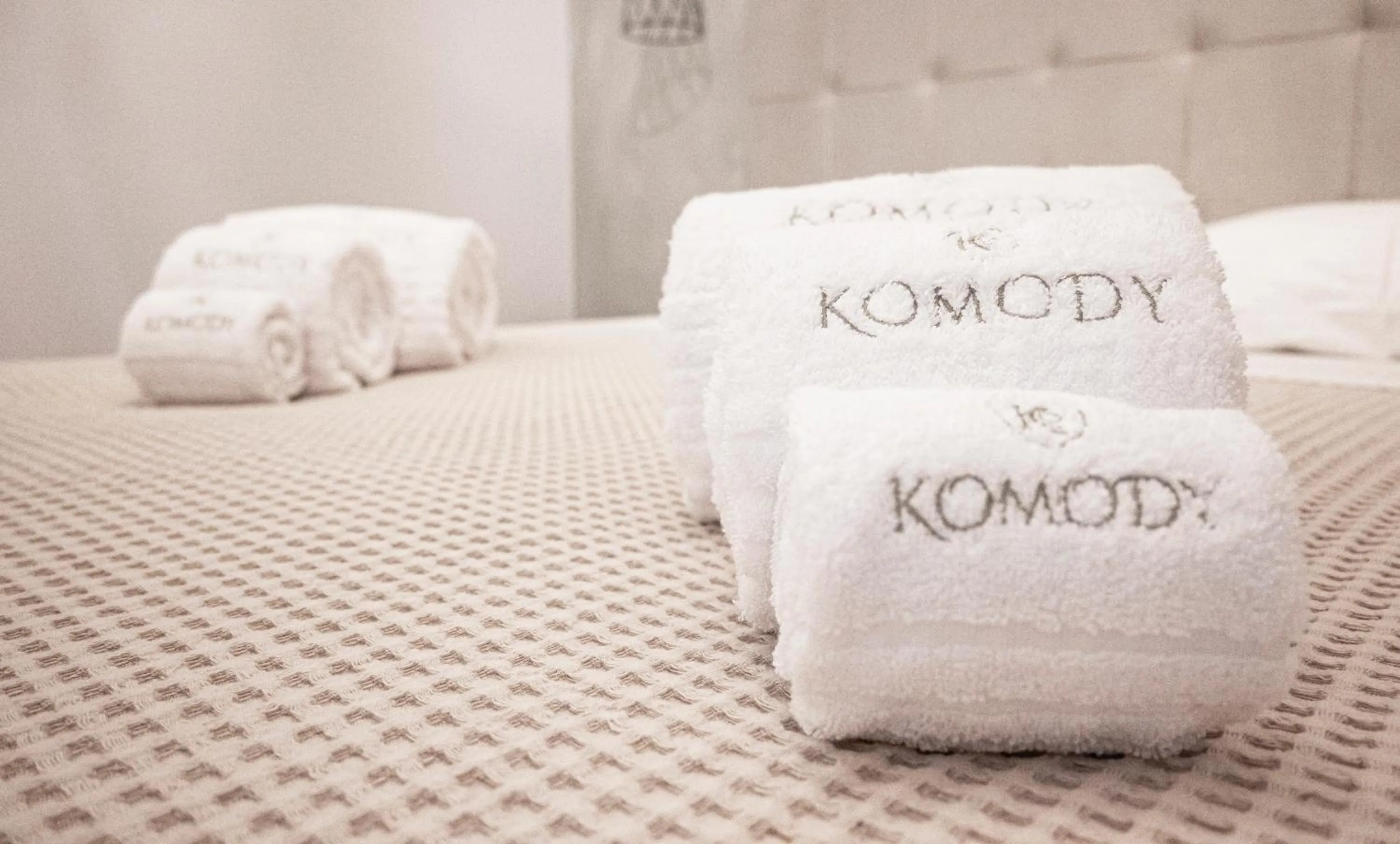 Bed in Komody Apartments