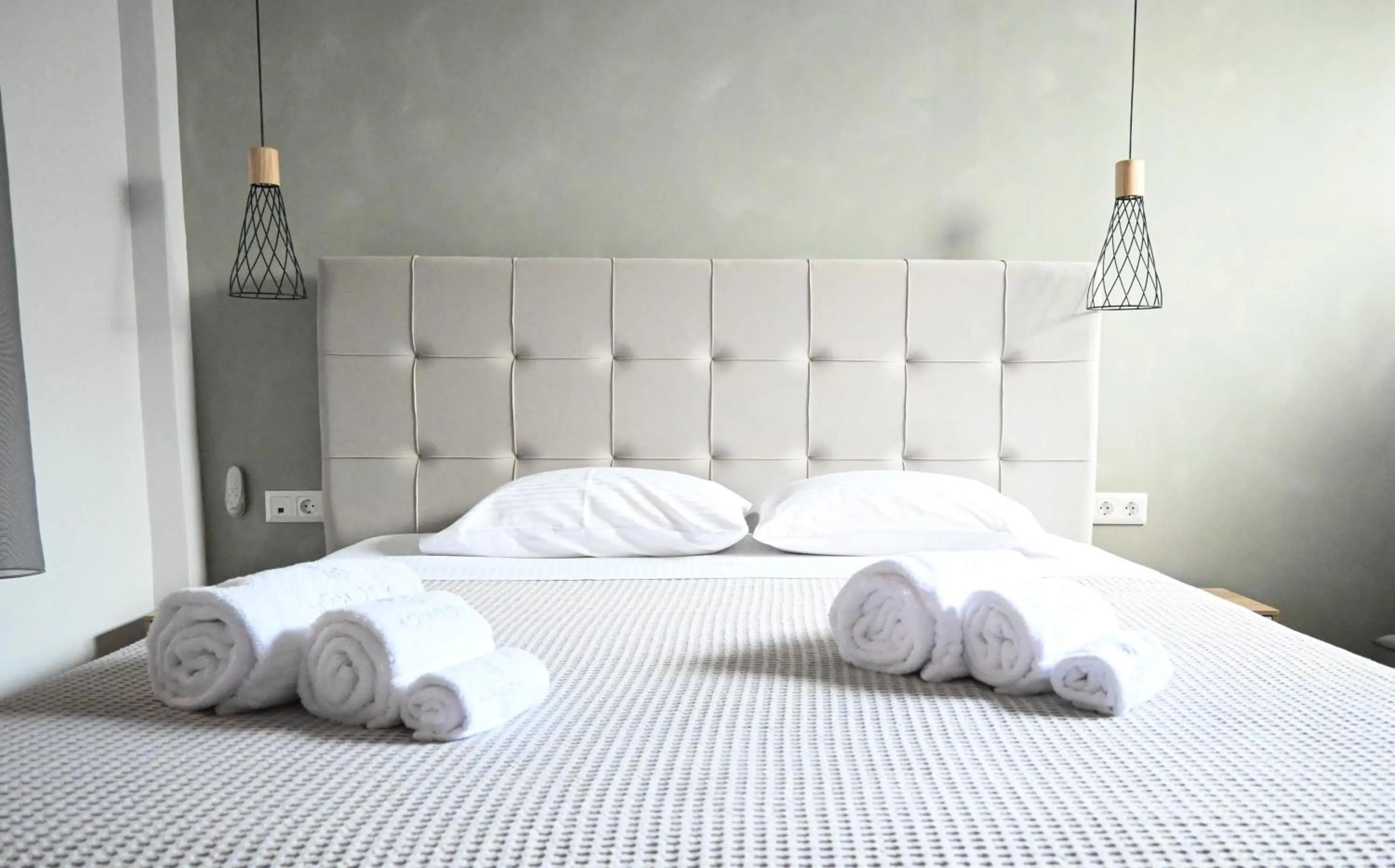 Bed in Komody Apartments