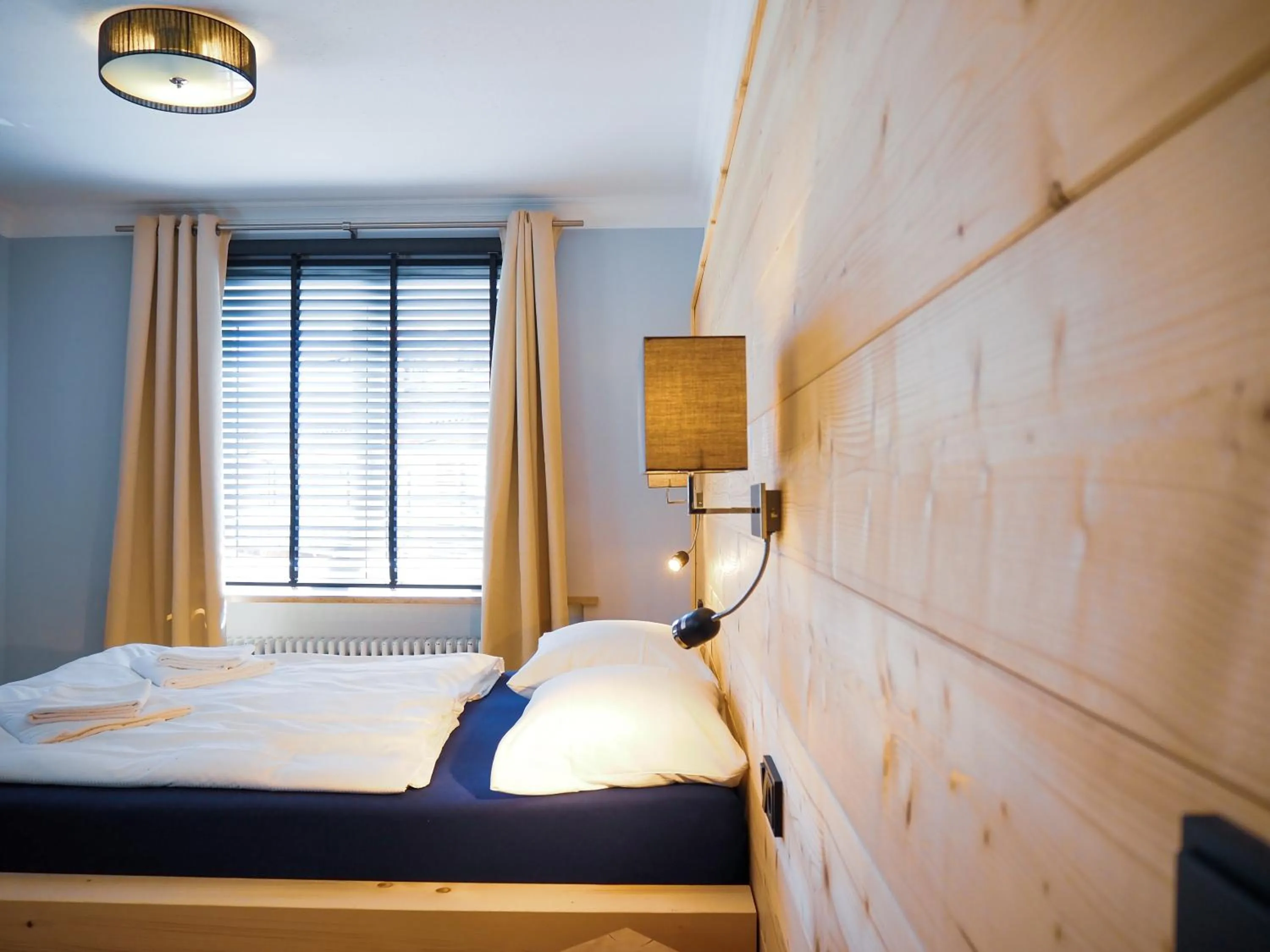 Bedroom, Bed in Design Hotel ALPENLIEBE - - - - Boutique-Flair - - - -