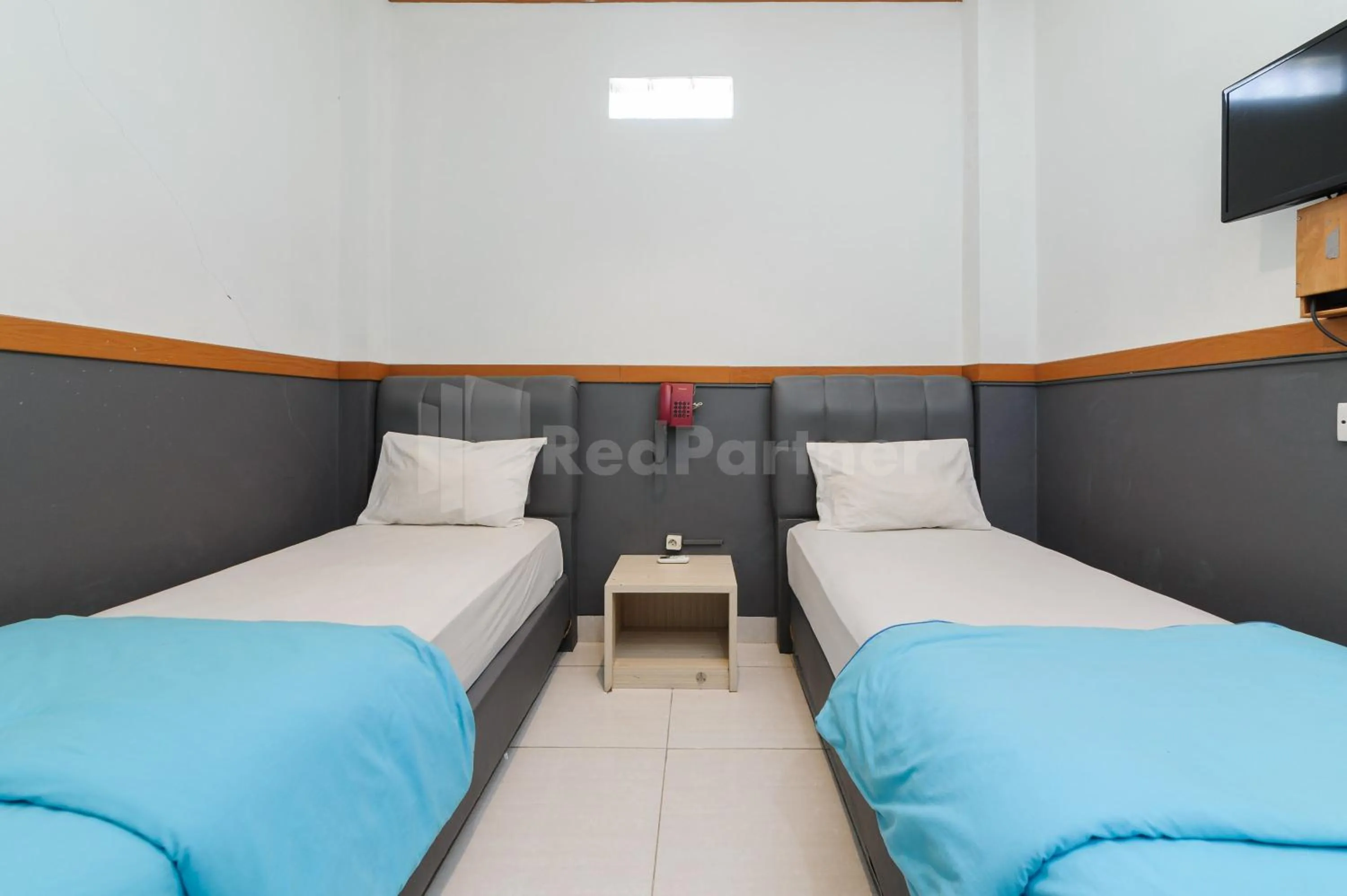 Bedroom, Bed in Ian Hotel Jaksa Mitra RedDoorz