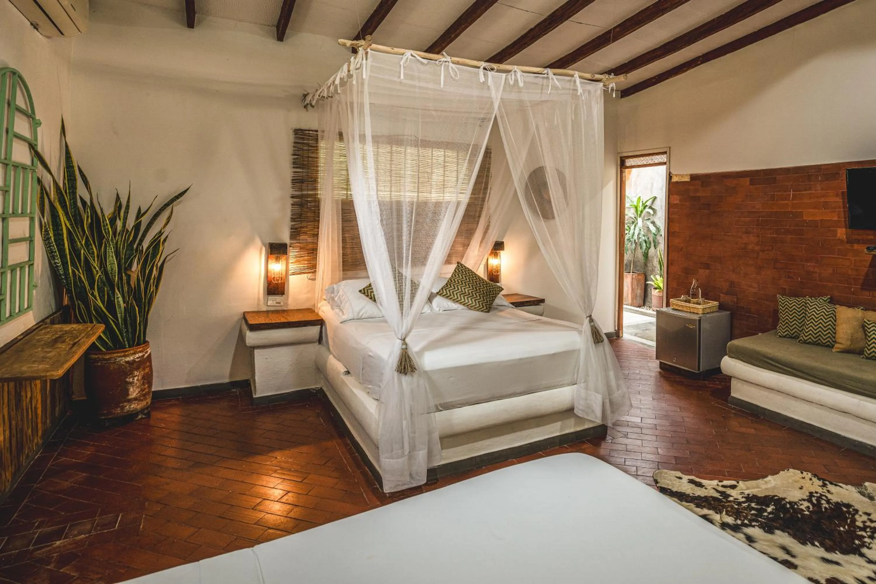 Seating area, Bed in Waka Hotel Rural