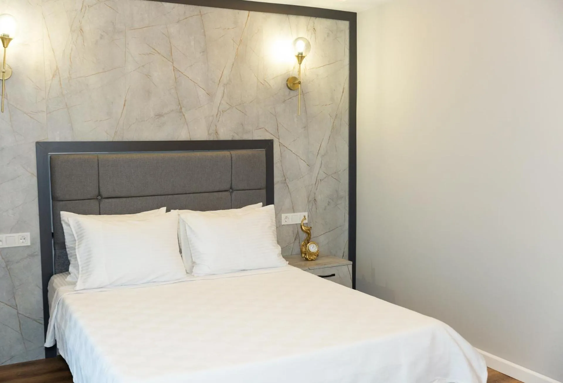 Bed in The Hera Business Hotels & Spa