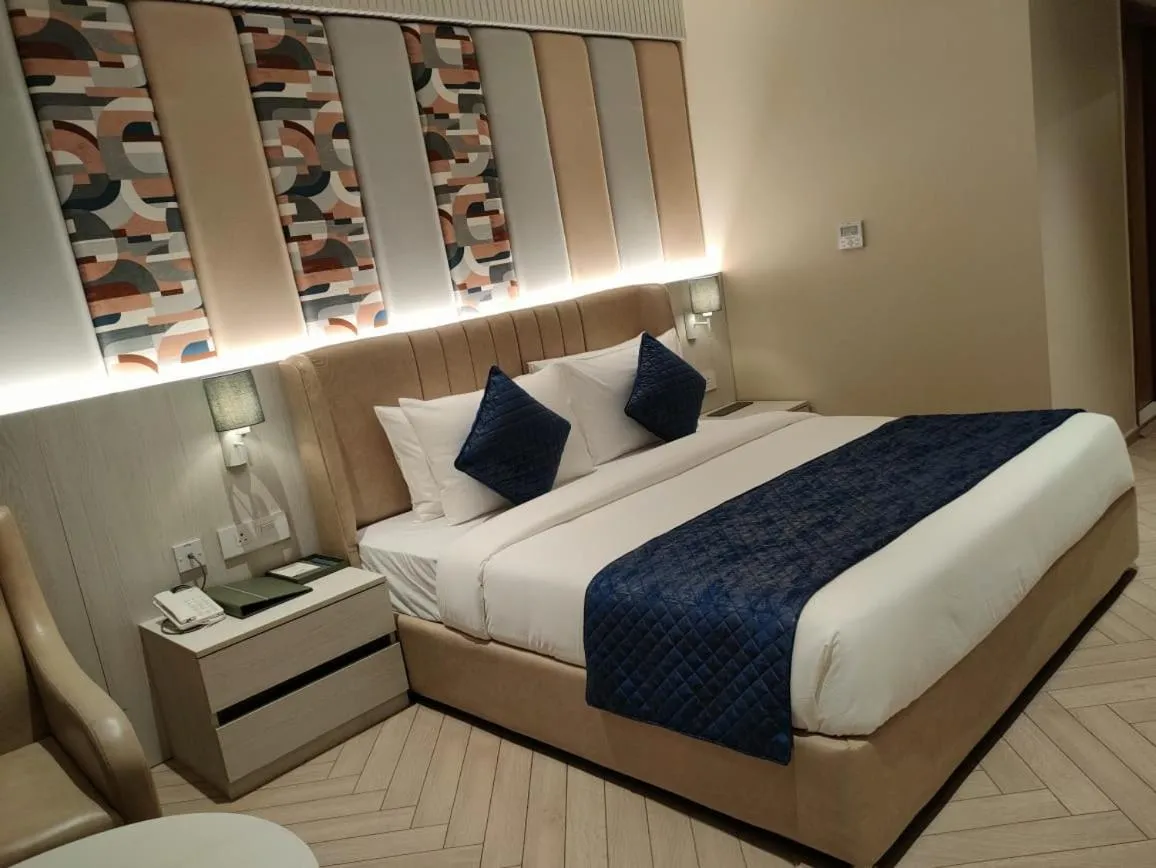 Bed in Chinmay Hotel & Resort