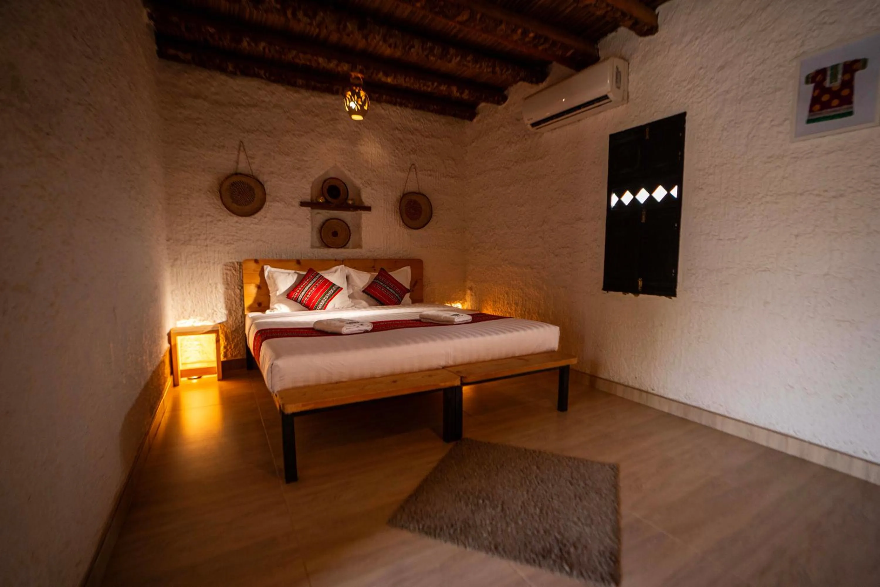 Bed in Sama al Wasil Desert Camp