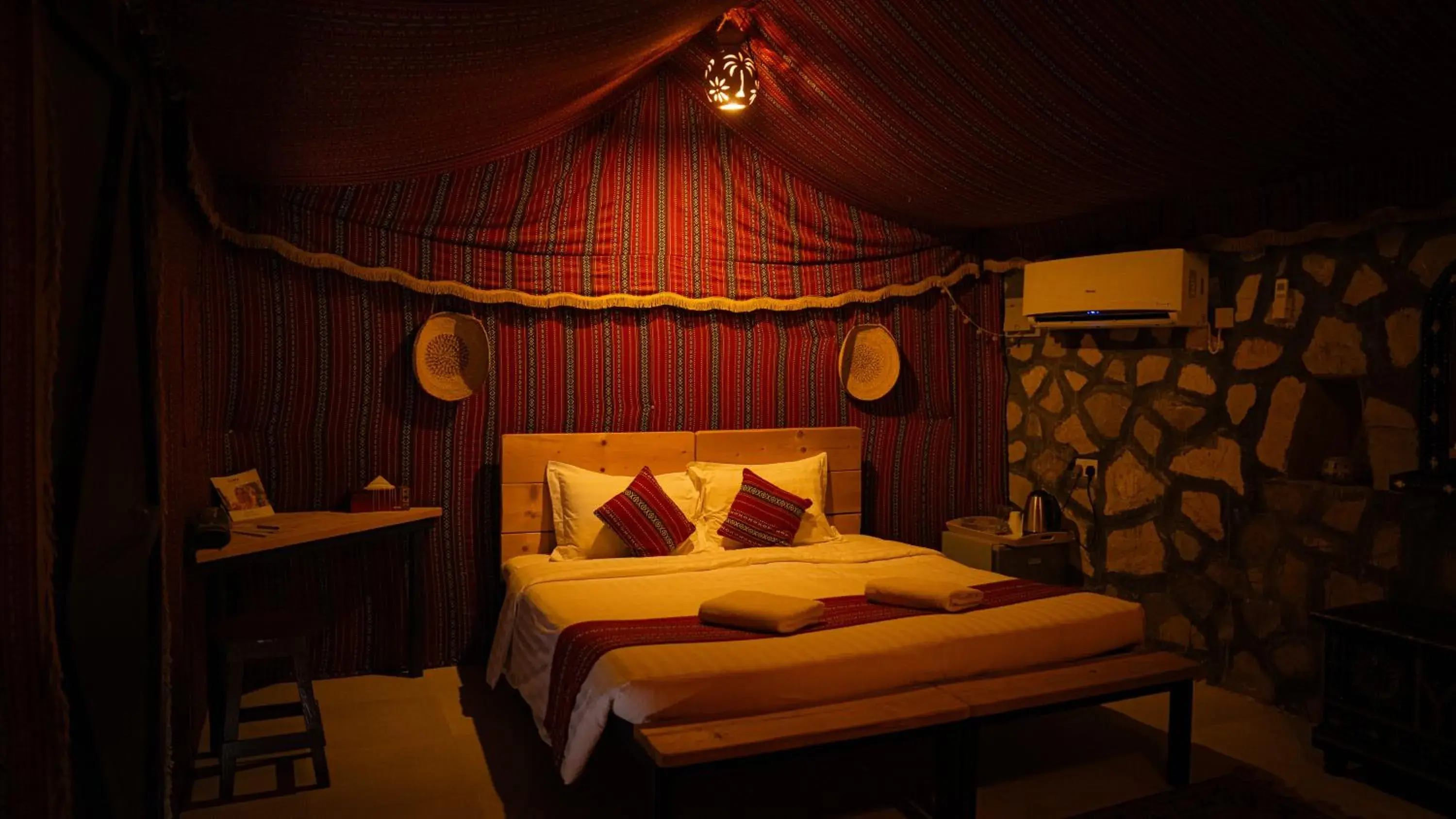 Bed in Sama al Wasil Desert Camp Bed in Sama al Wasil Desert Camp