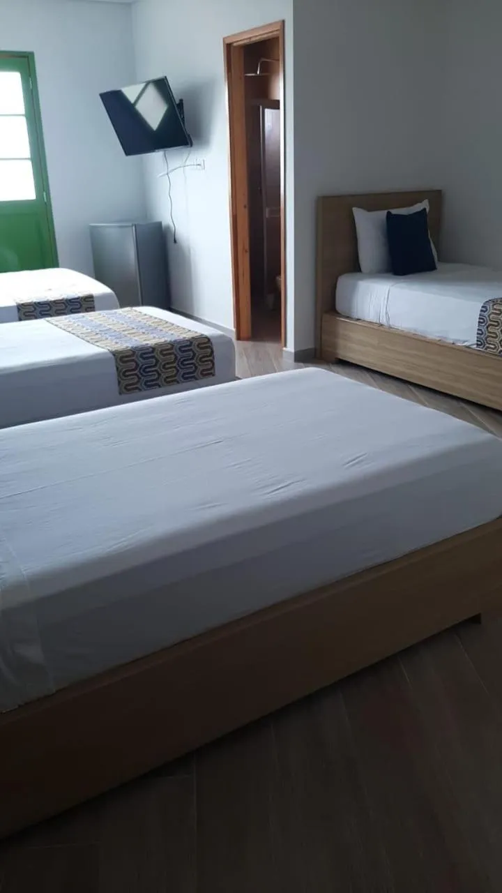 Bed in ALTO VERDE HOTEL