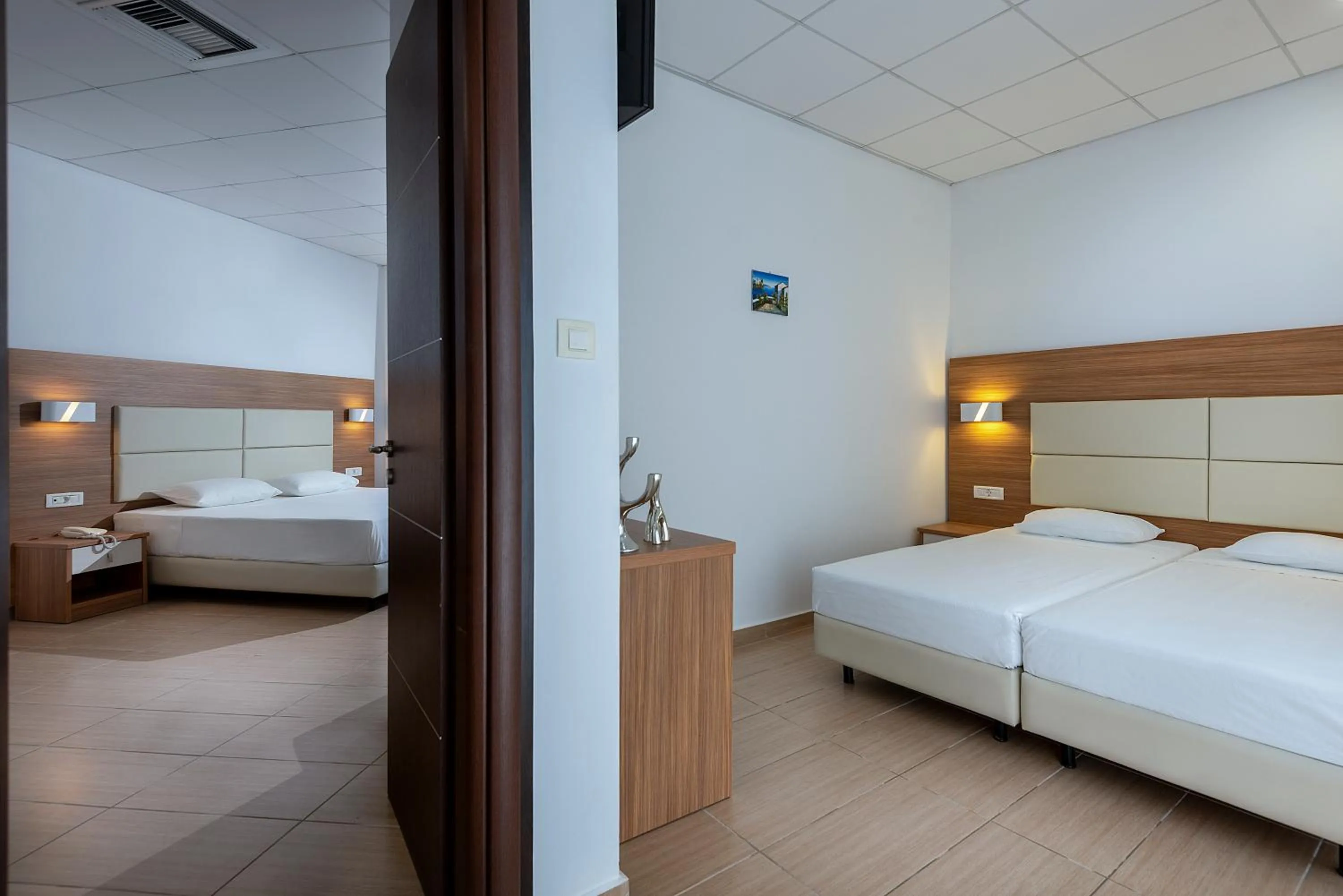 Bedroom, Bed in Royal Bay Suites