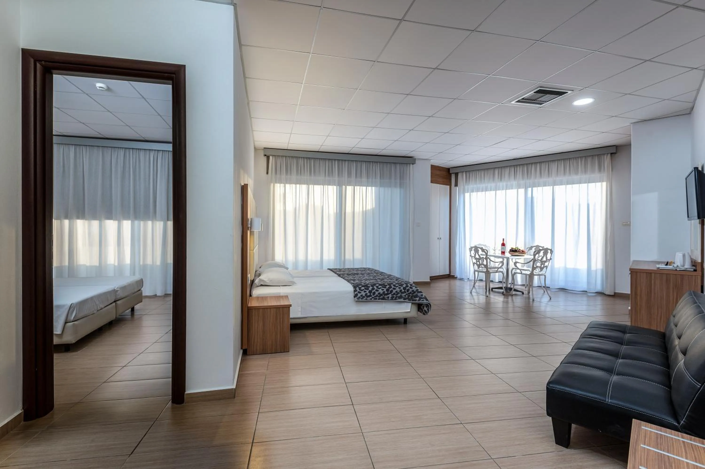 Photo of the whole room, Bed in Royal Bay Suites