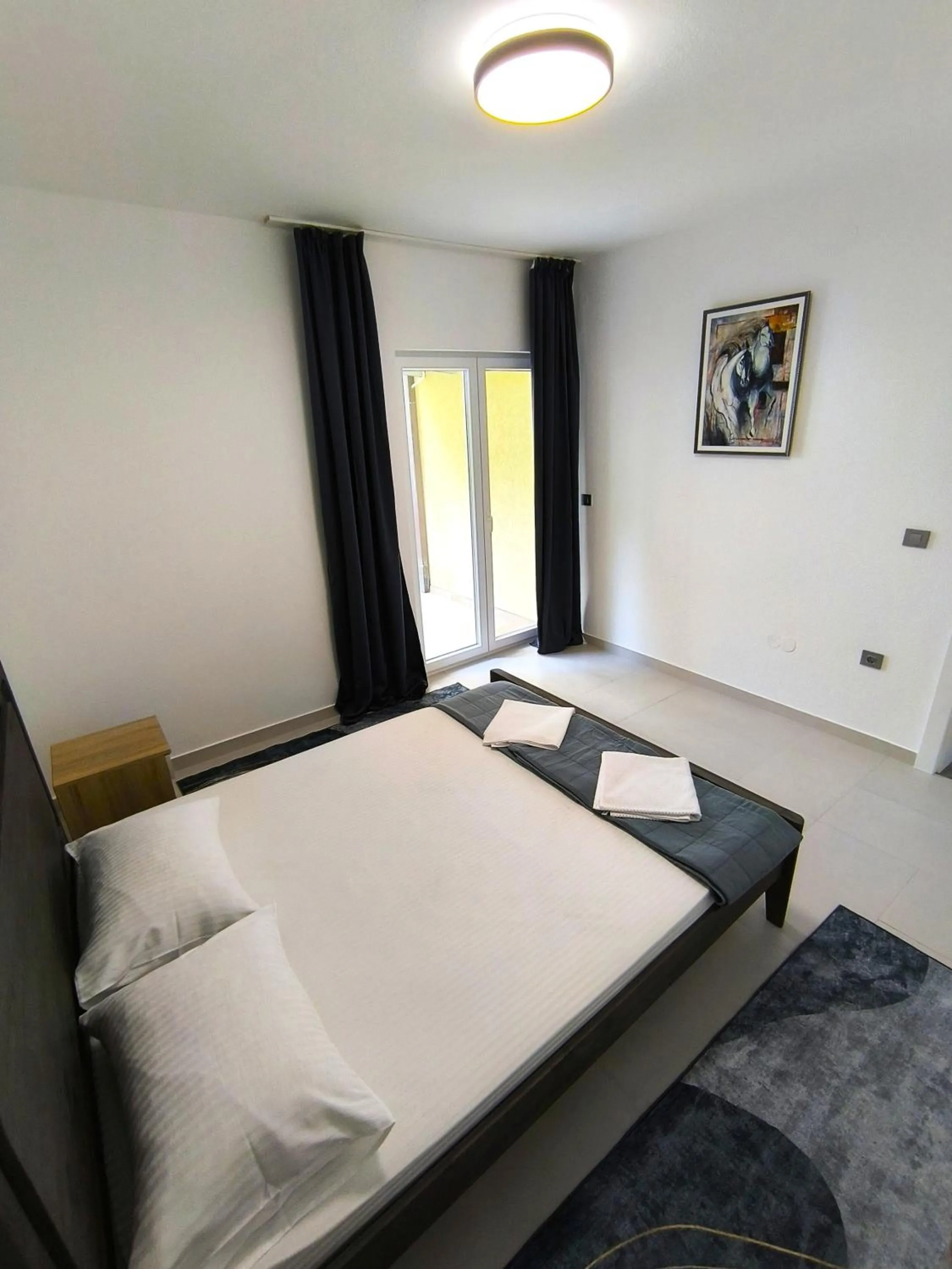 Bed in Apartments Danilo