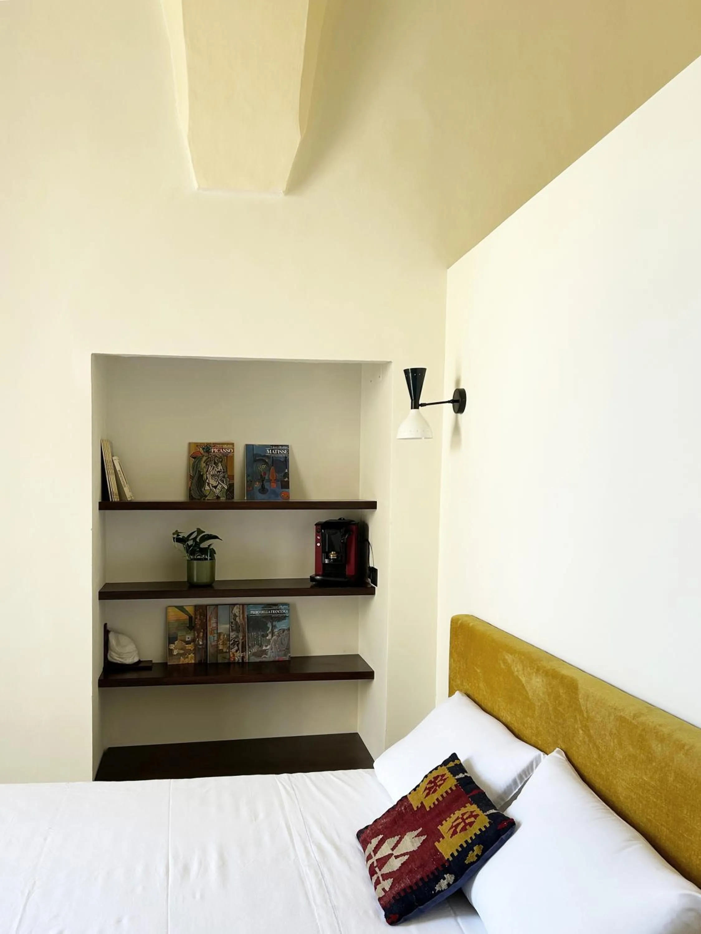 Bed in Roiss Haus Suites