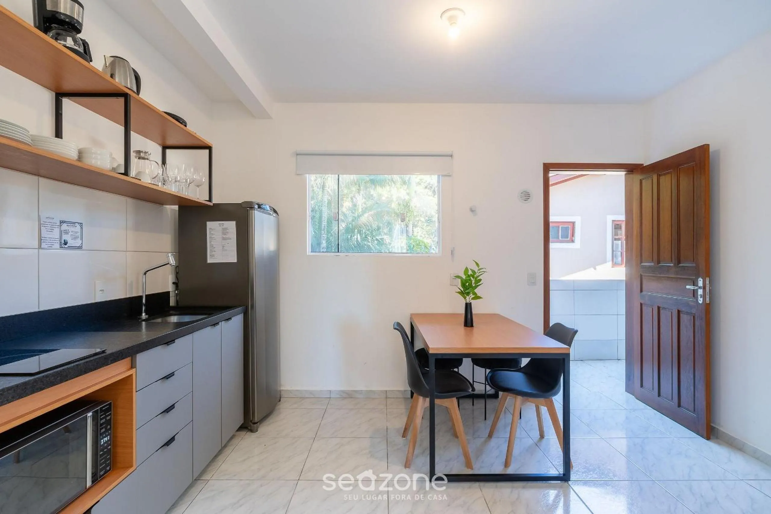 Kitchen or kitchenette in Apartamentos em Jurerê - JMA