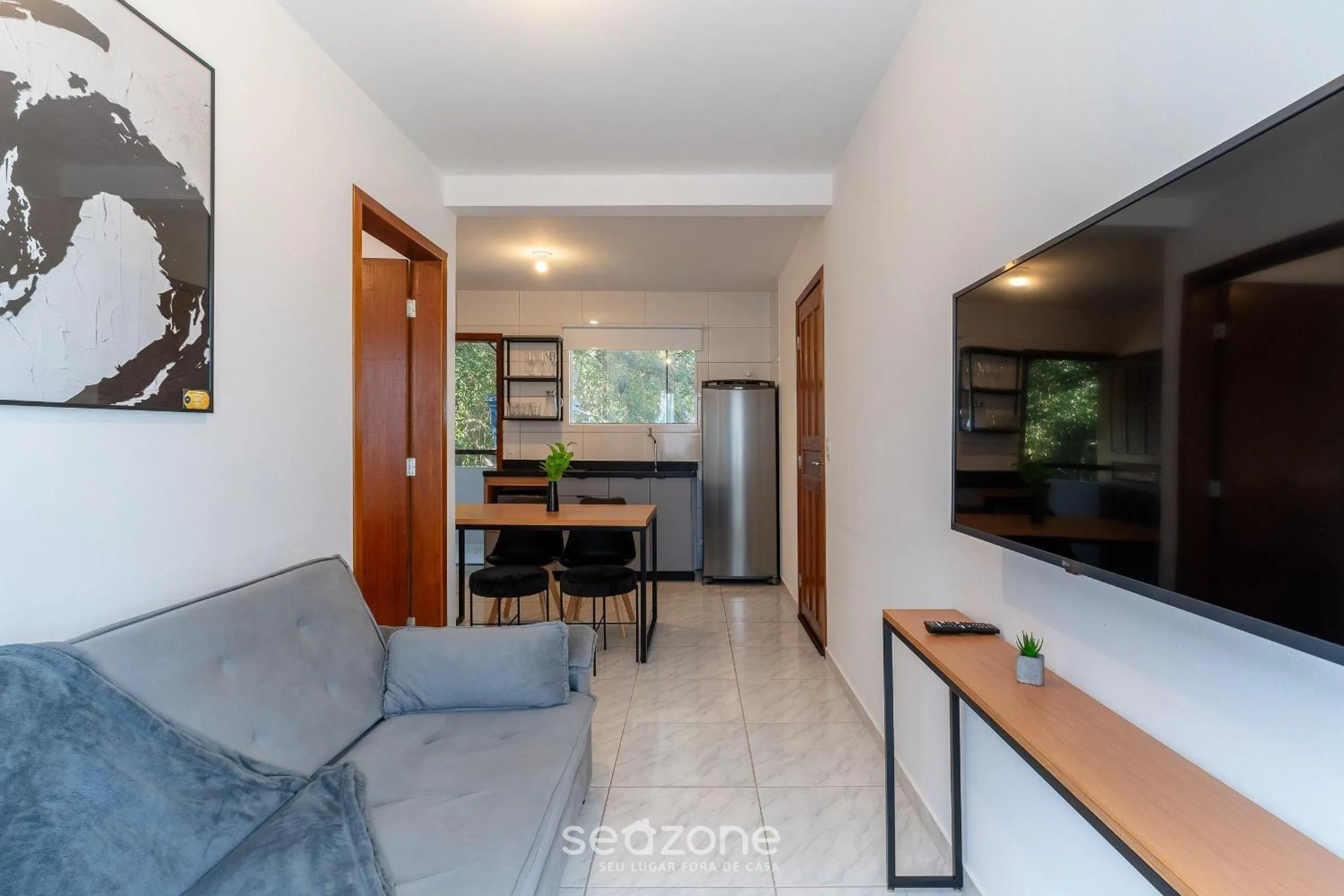 TV and multimedia in Apartamentos em Jurerê - JMA