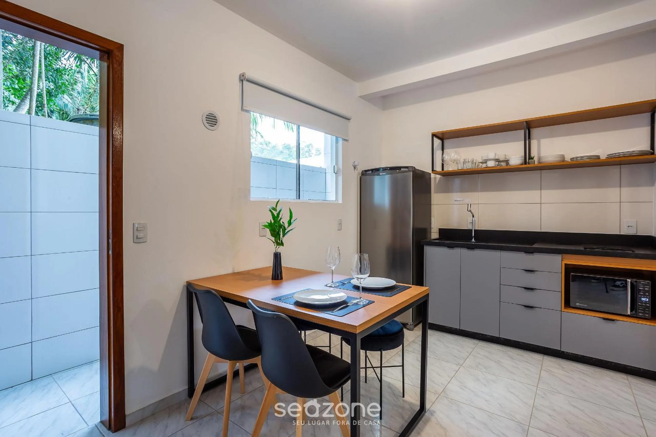 Kitchen or kitchenette in Apartamentos em Jurerê - JMA