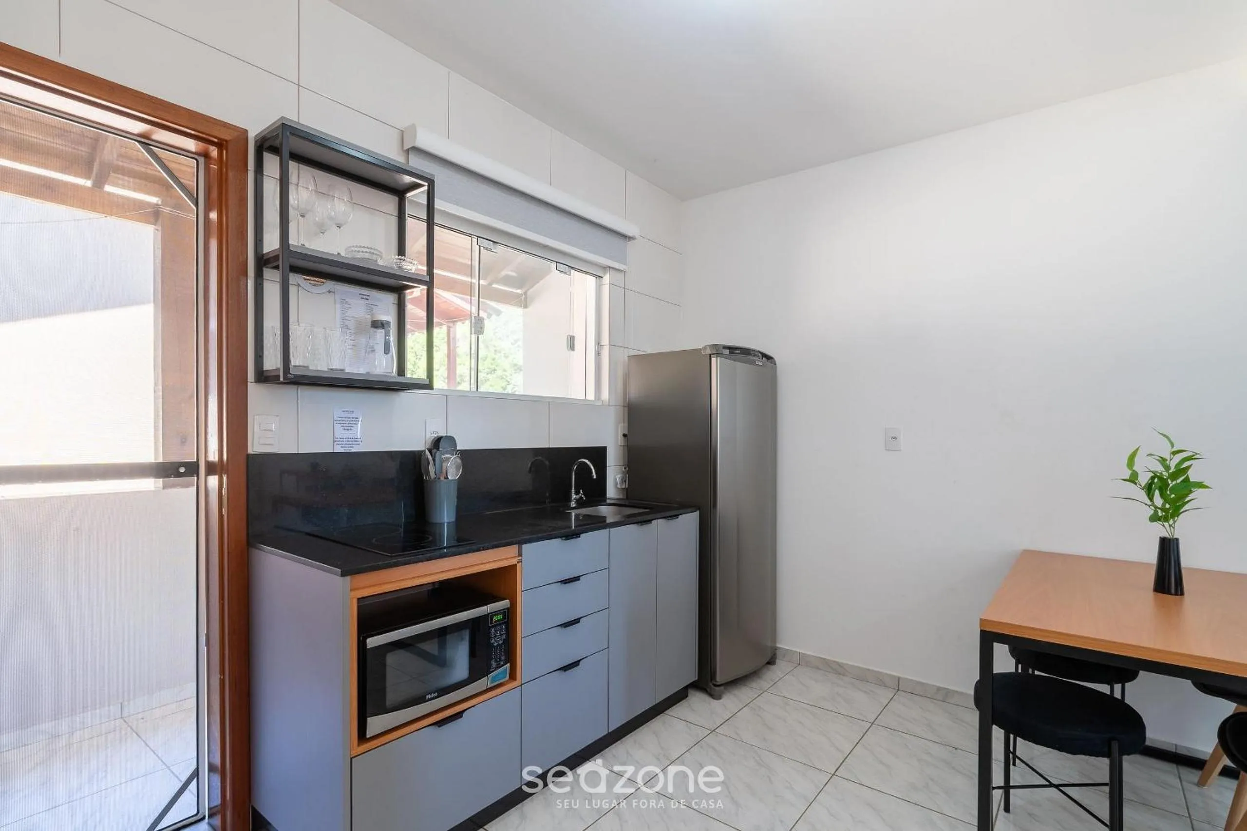 Kitchen or kitchenette in Apartamentos em Jurerê - JMA