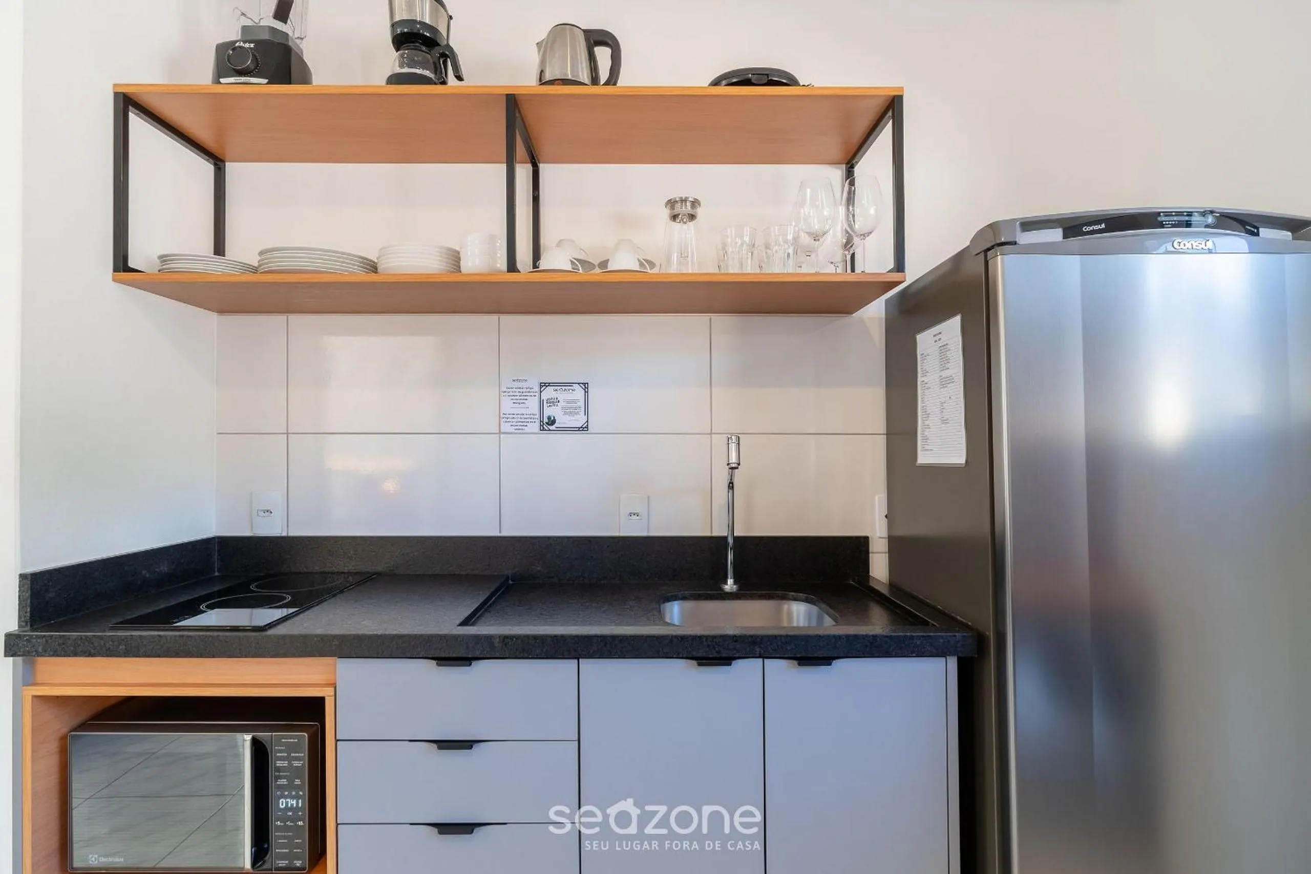 Kitchen or kitchenette in Apartamentos em Jurerê - JMA