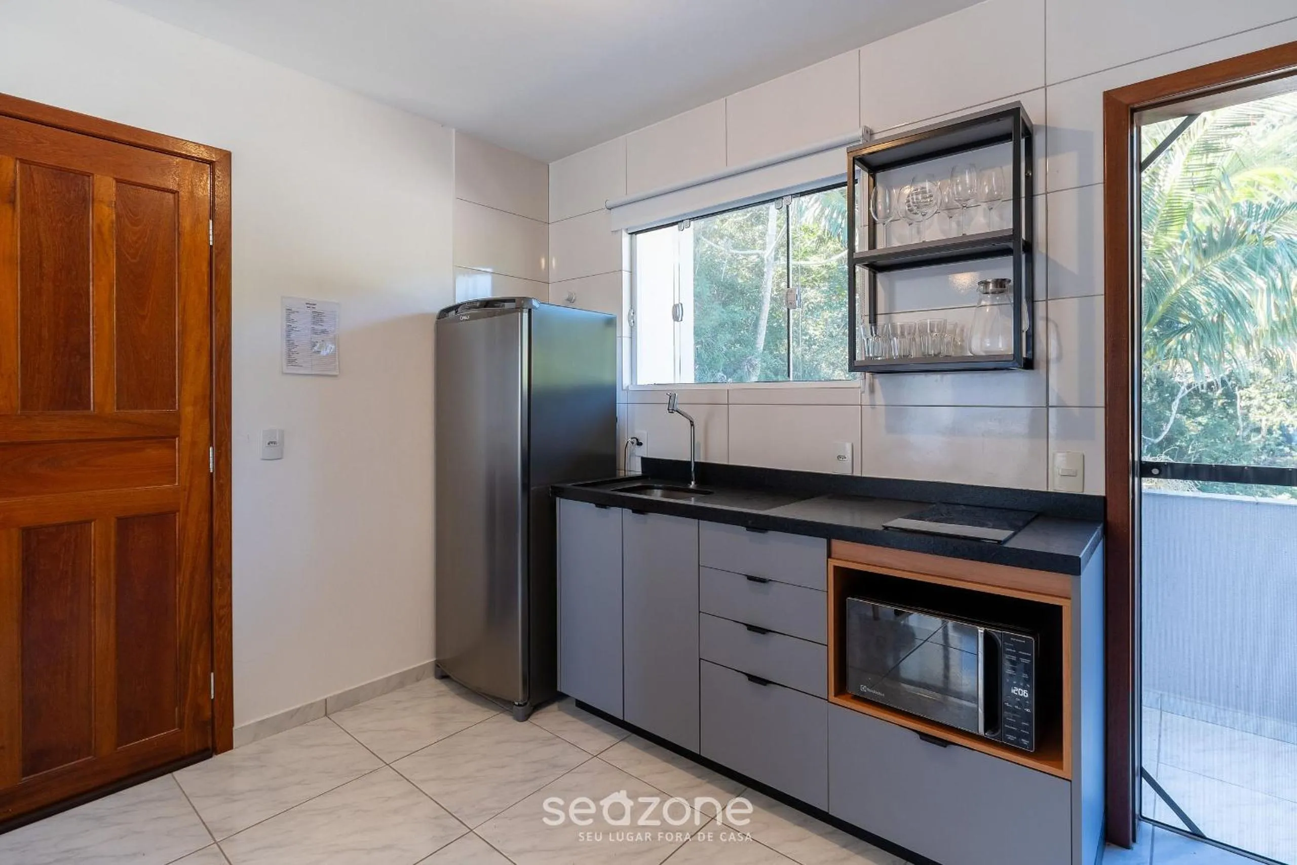 Kitchen or kitchenette in Apartamentos em Jurerê - JMA