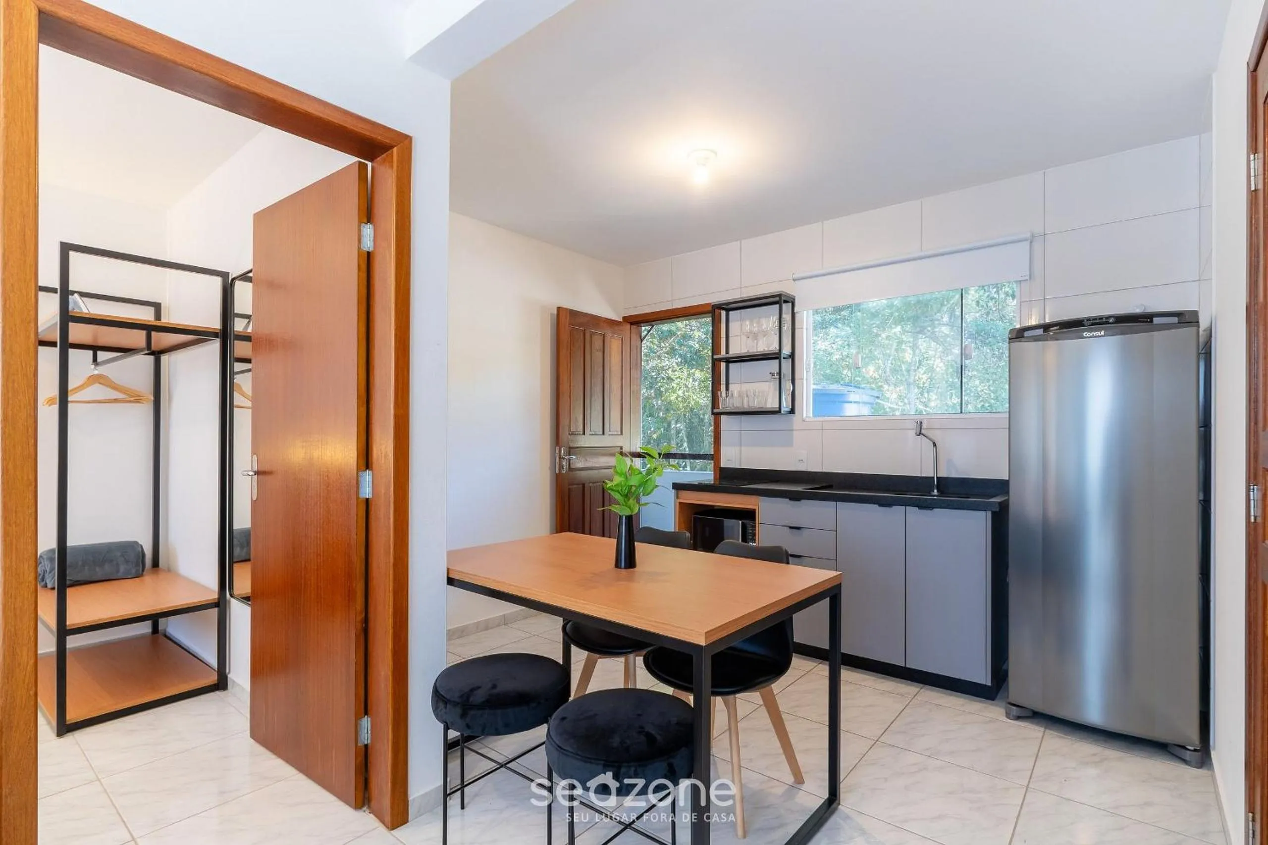 Kitchen or kitchenette in Apartamentos em Jurerê - JMA