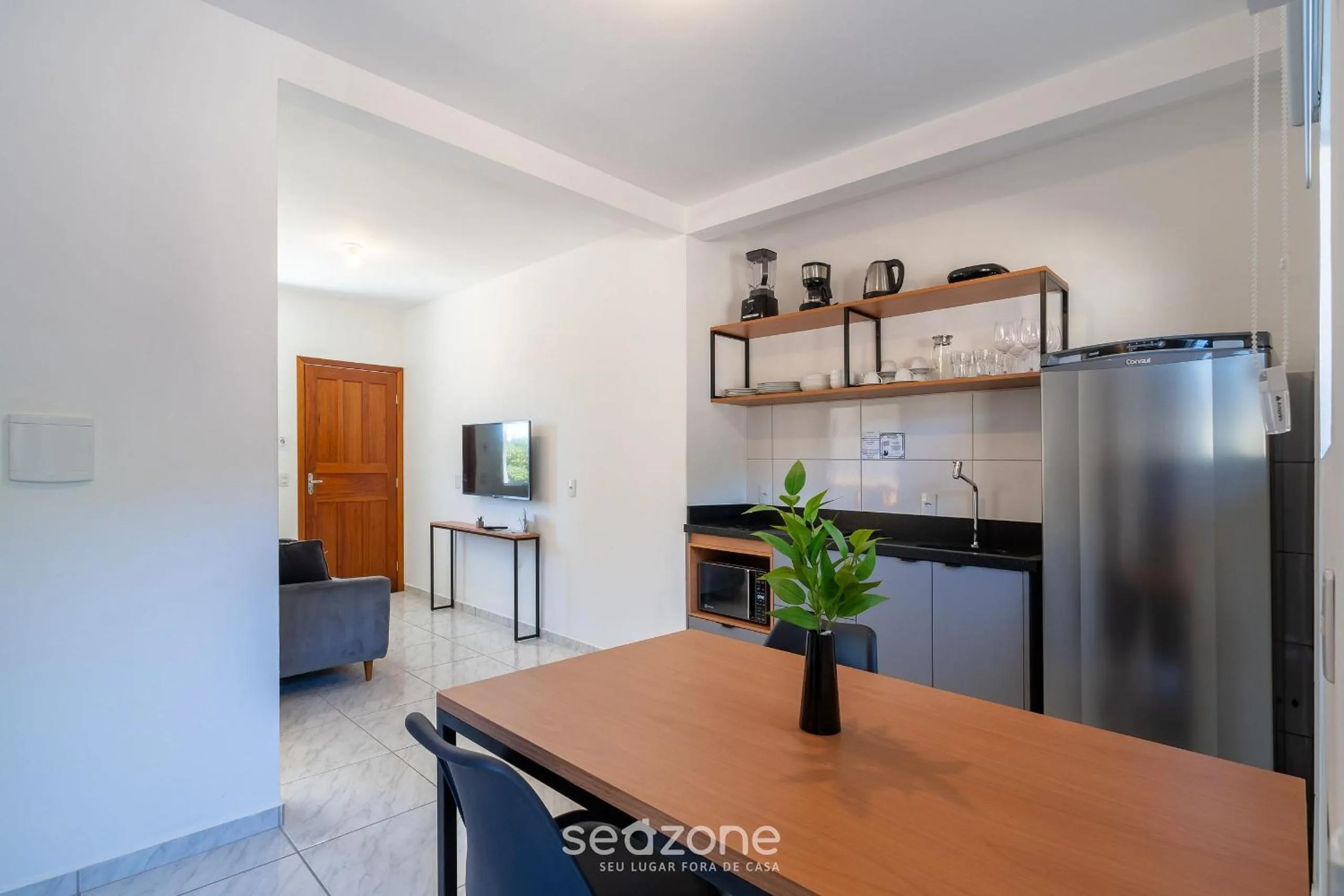 Kitchen or kitchenette in Apartamentos em Jurerê - JMA