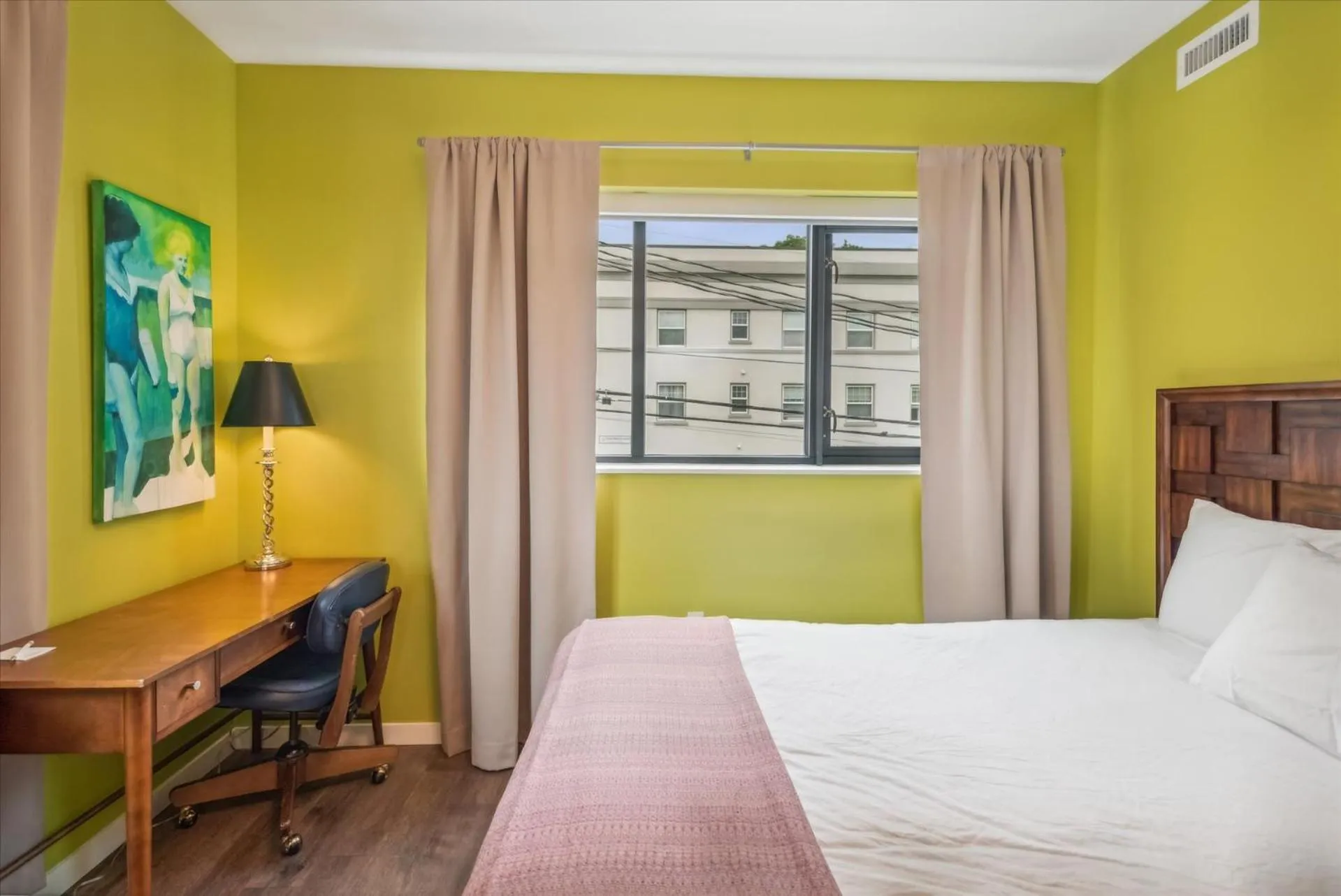 Bed in VioletSuitesPDX Boutique Hotel