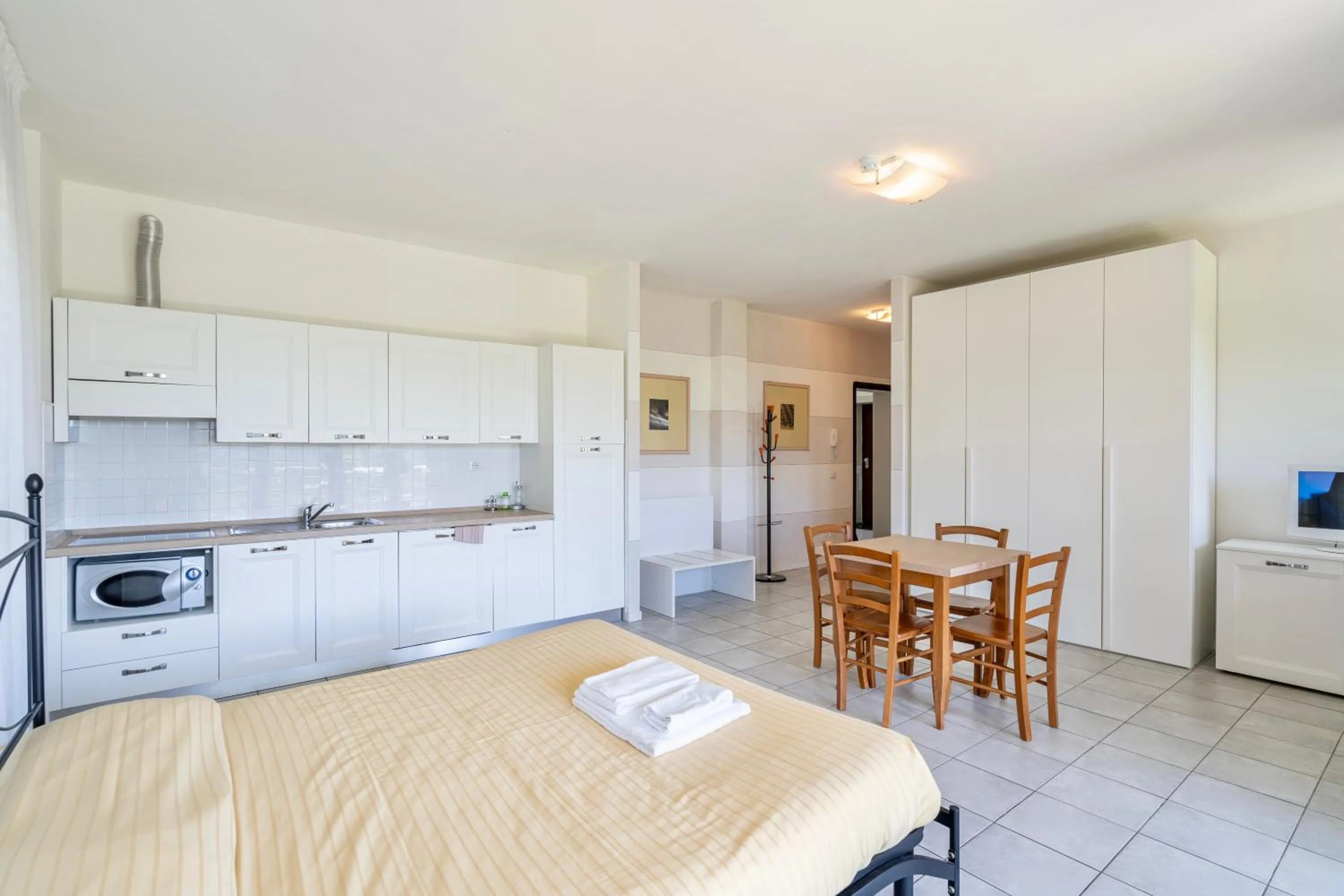 Bed in ISA-Residence with swimming-pool in Barberino-Tavernelle, apartments with air conditioning and private outdoor area