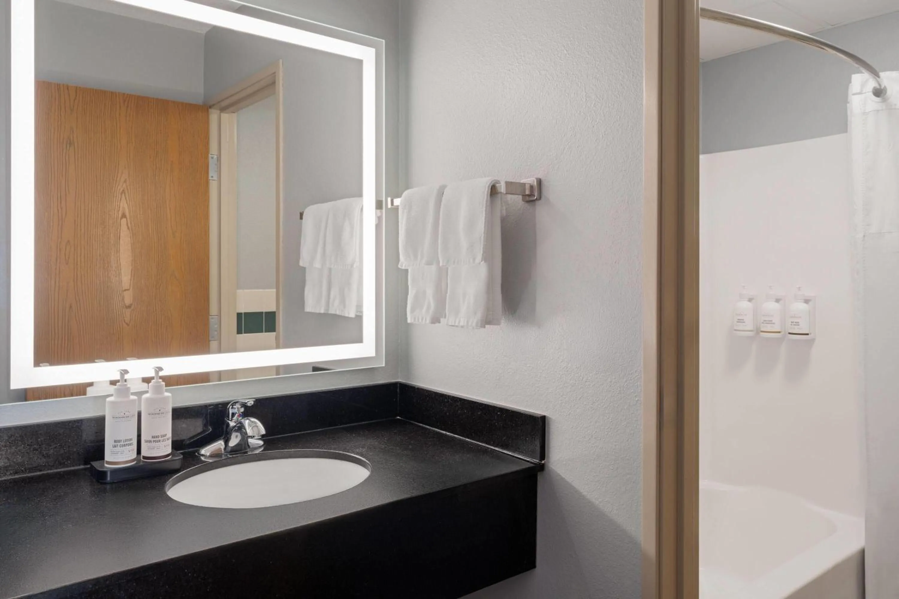 Bathroom in AmericInn by Wyndham Grand Forks