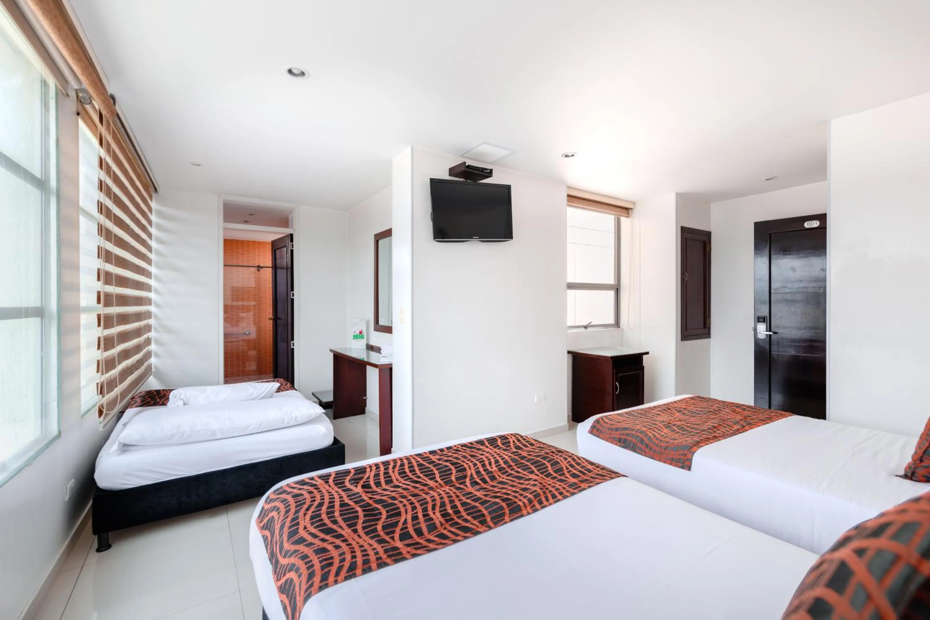 Communal lounge/ TV room, Bed in Hotel Parque 63