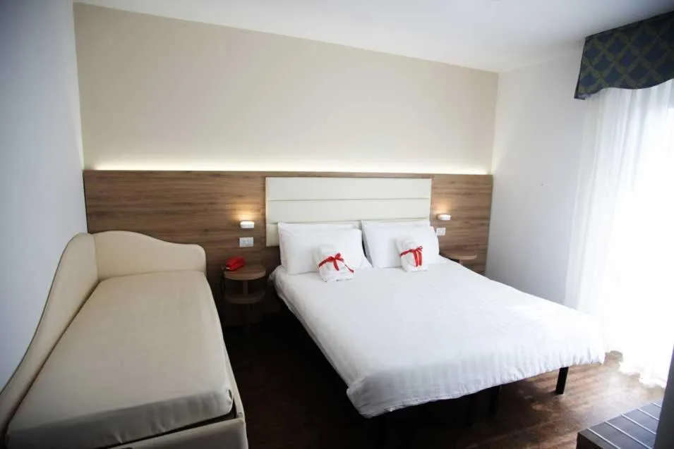 Bed in Hotel Gardenia