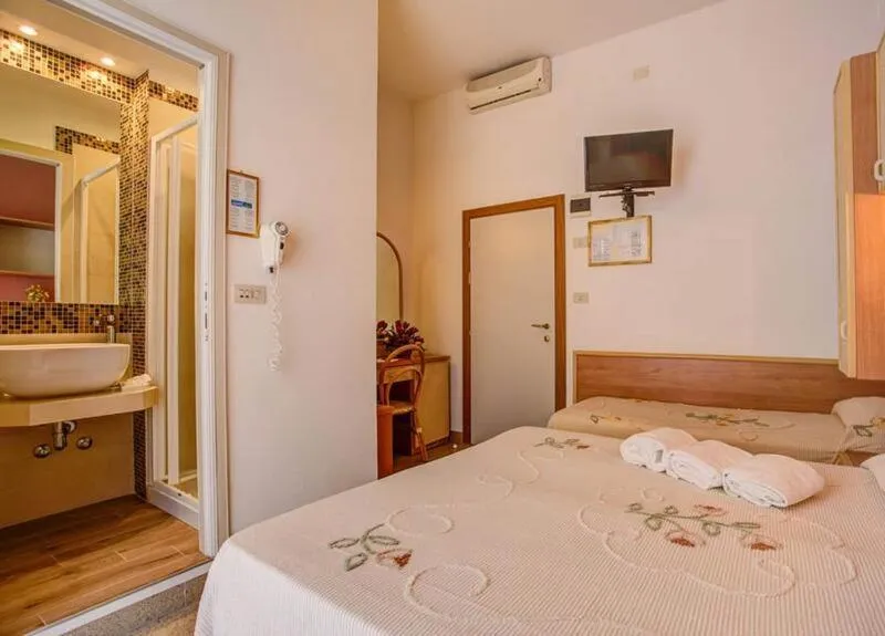 Bed in Hotel Gardenia