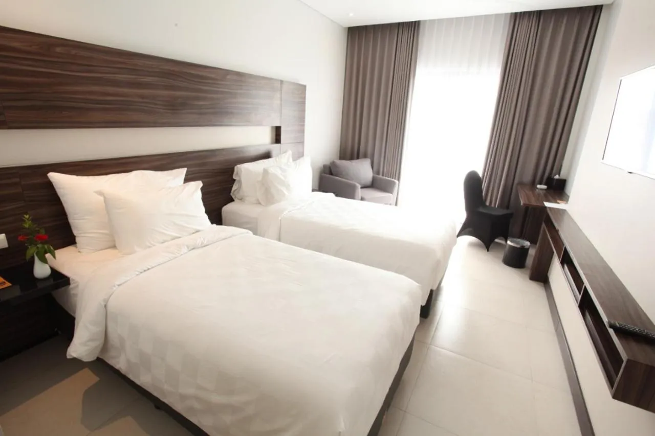 Bed in HELIOS HOTEL & CONVENTION
