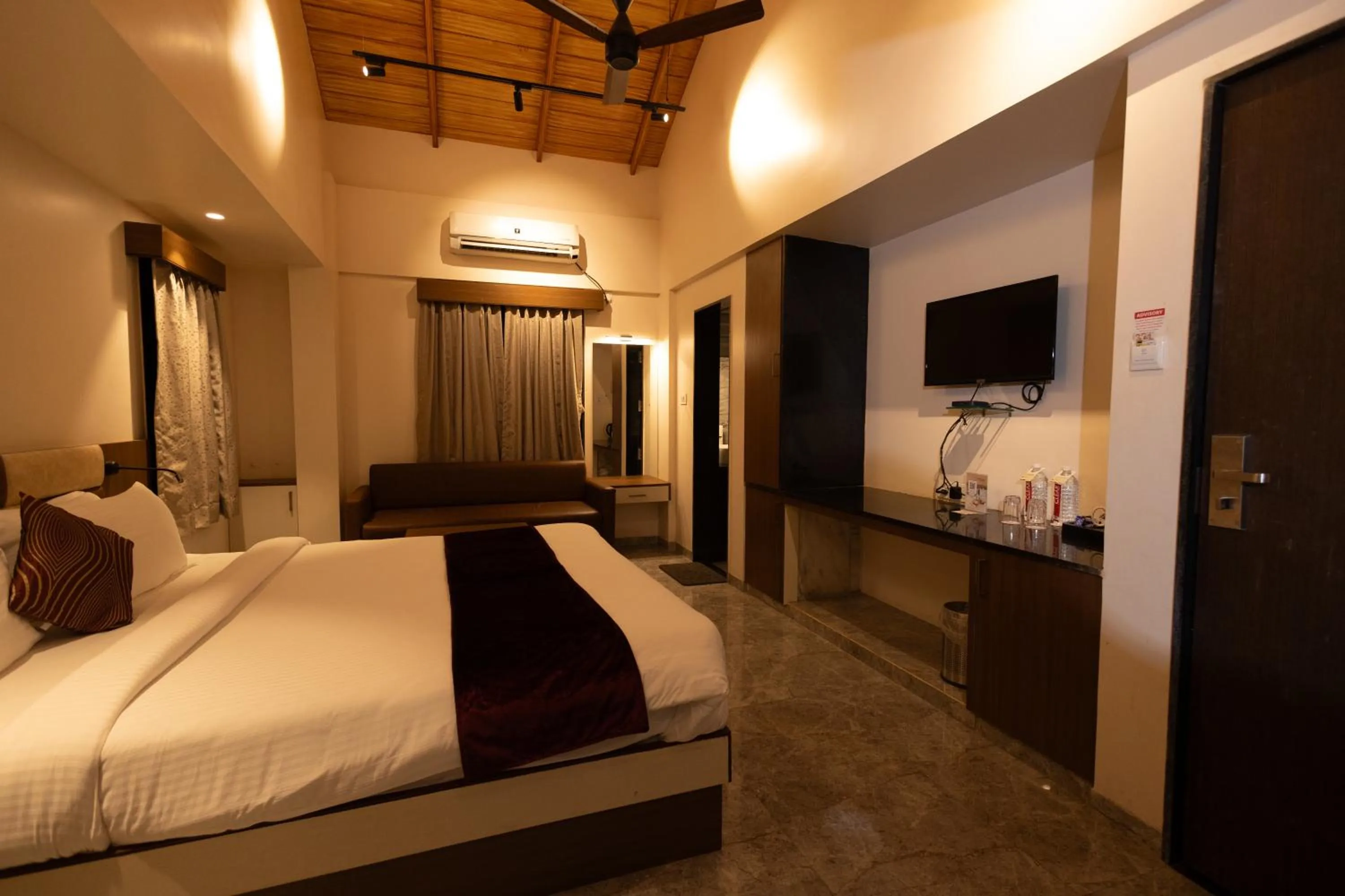 Bed in Freesia Resort by Express Inn