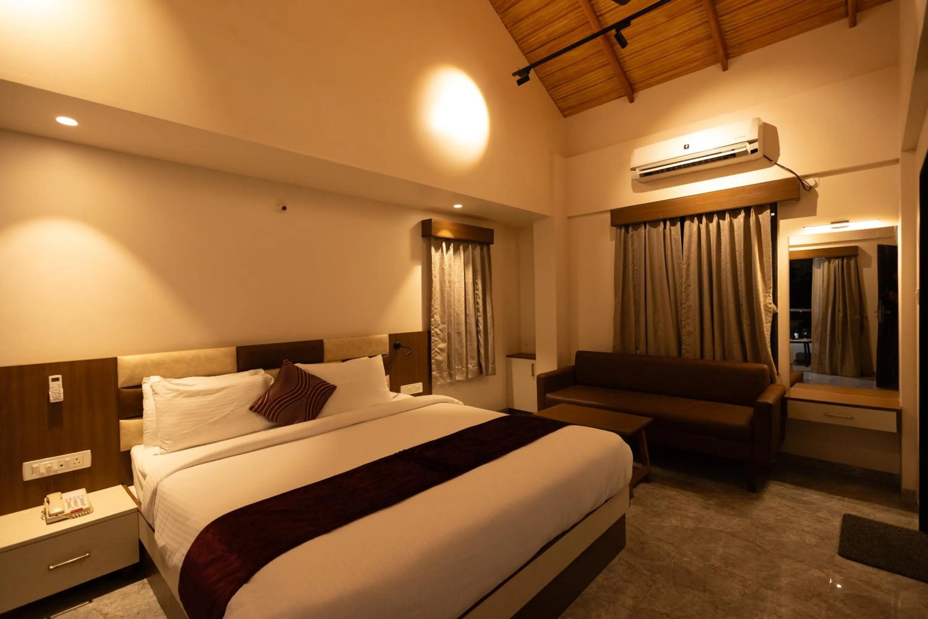 Bed in Freesia Resort by Express Inn