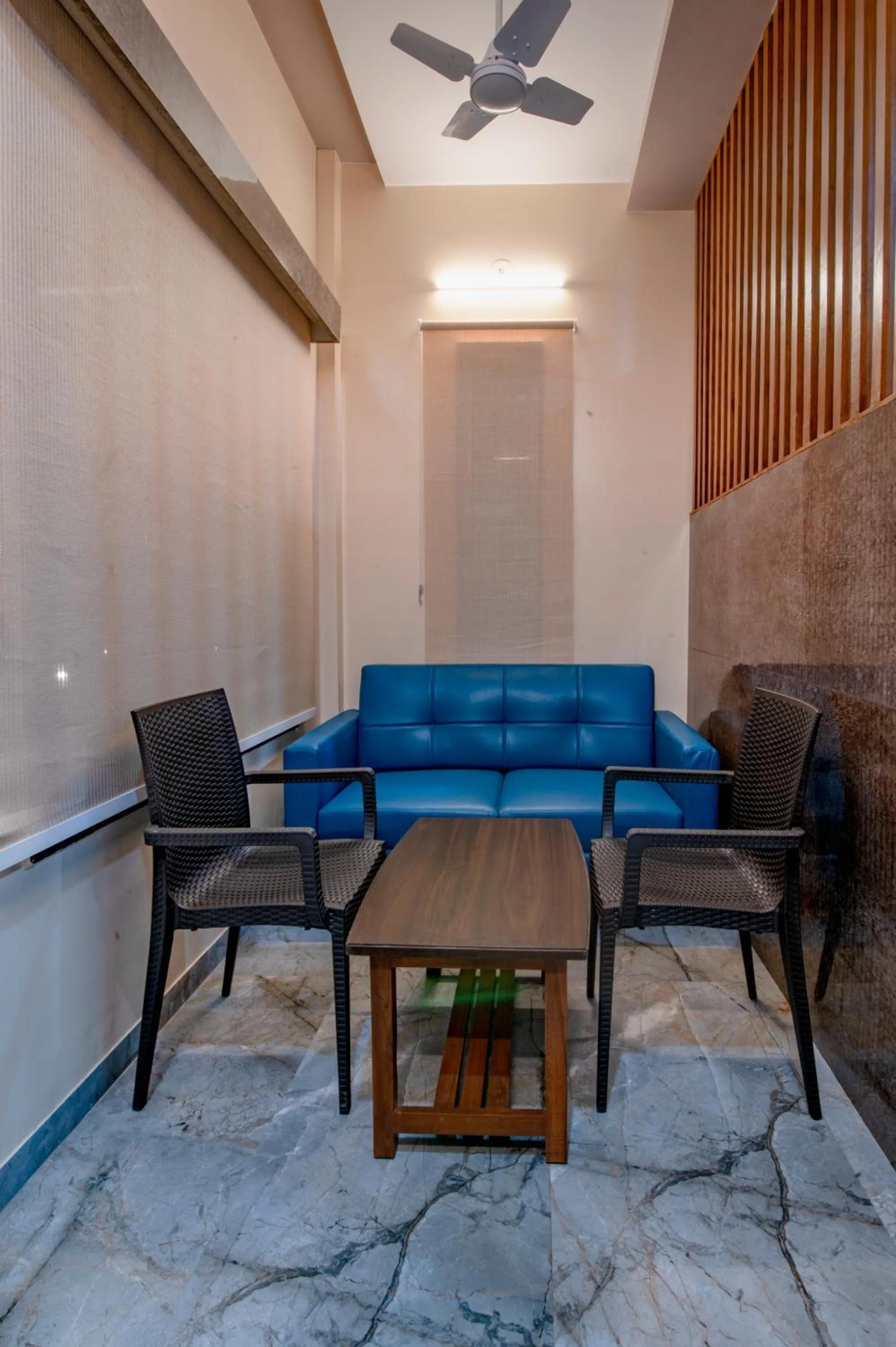 Seating area in Freesia Resort by Express Inn