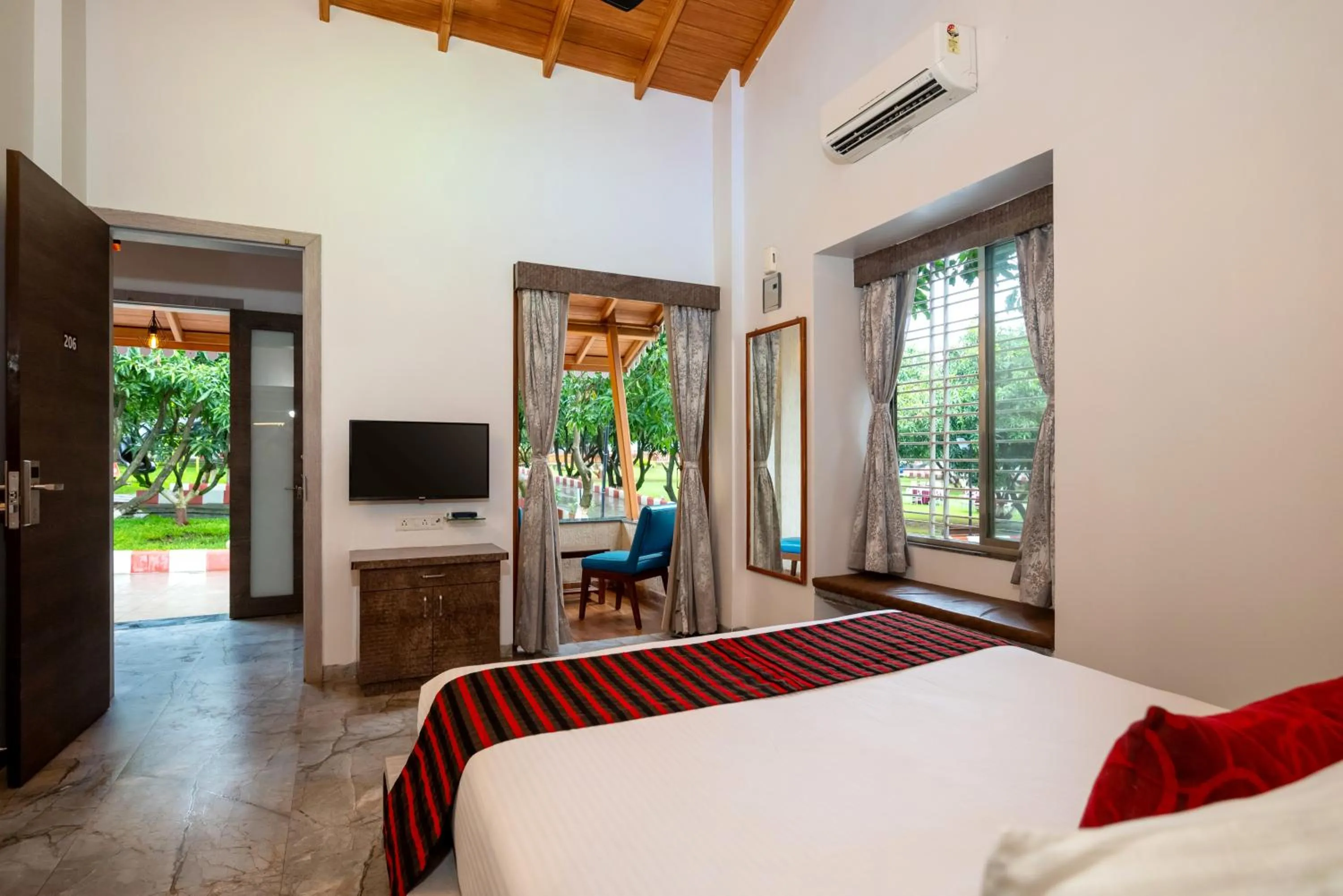 Bed in Freesia Resort by Express Inn